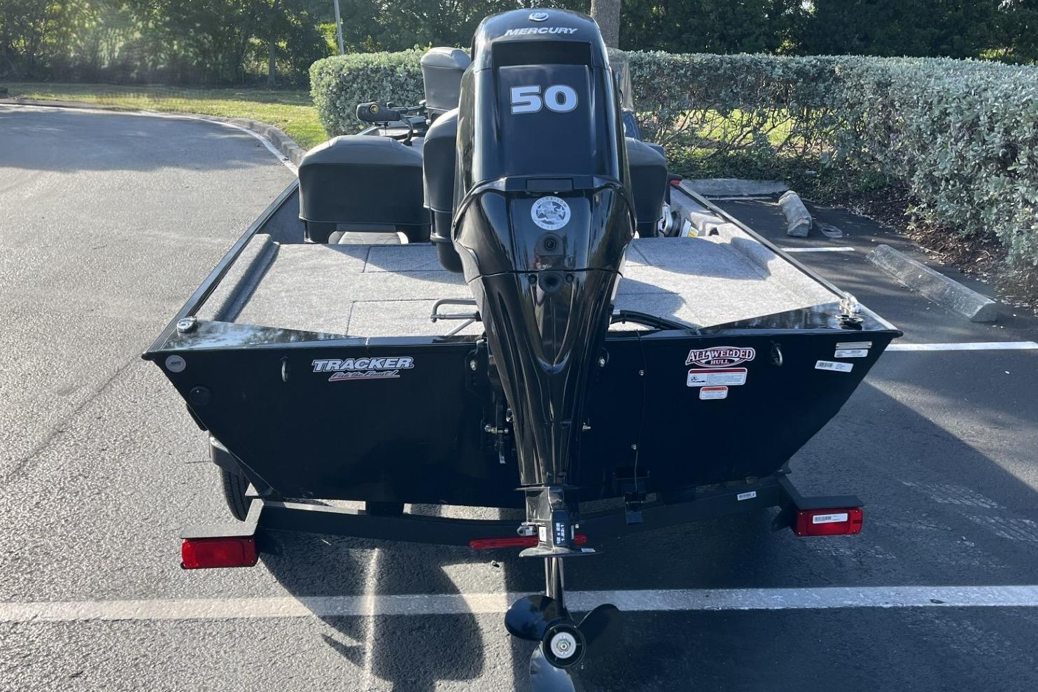 2026 Tracker Bass Tracker Classic XL boat with Mercury 50 engine, parked outdoors.