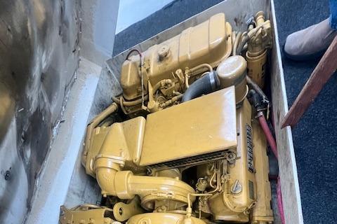 1972 REPCO Buxton Downeast Hardtop Cruiser engine in compartment, yellow machinery.