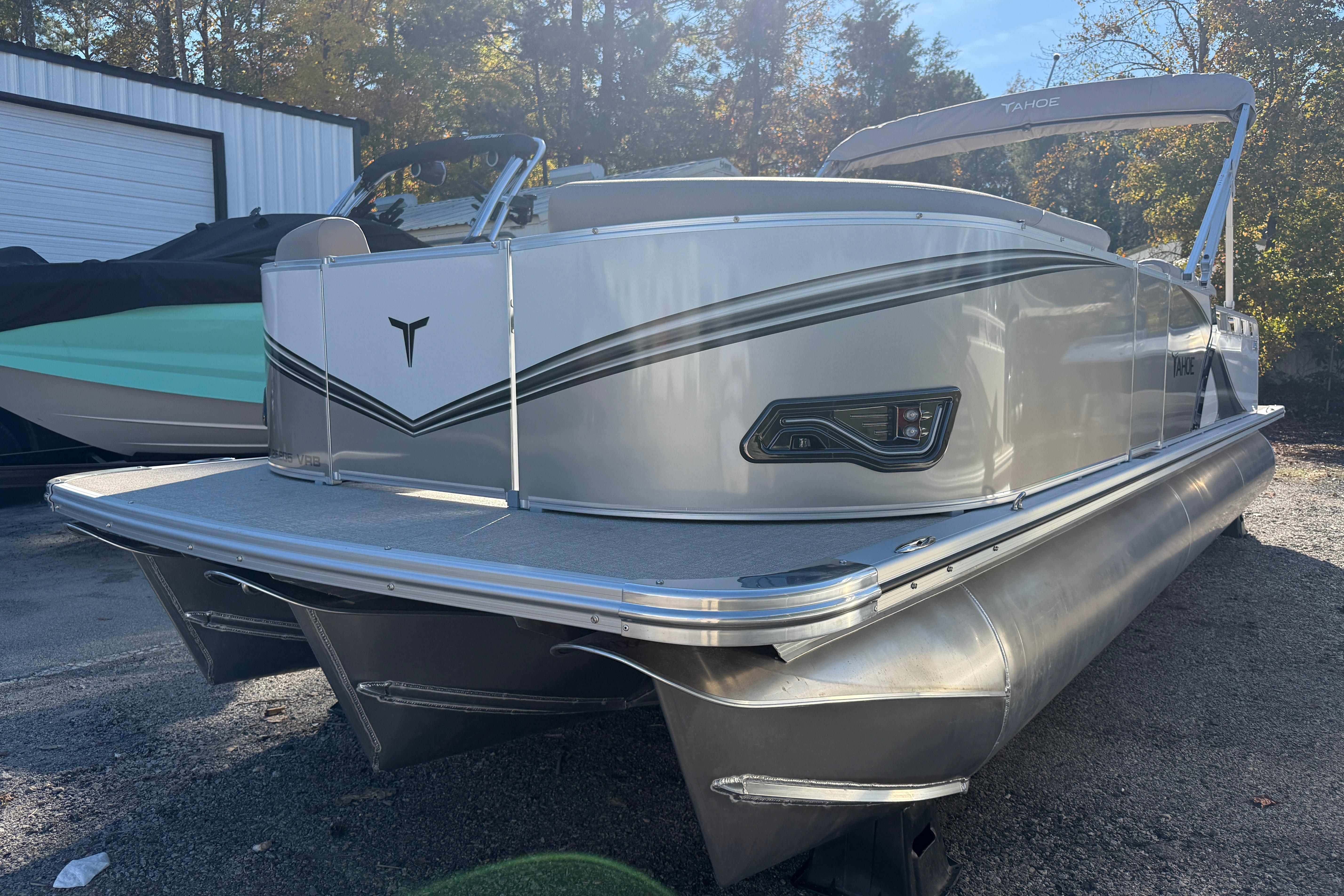 2026 Tahoe Pontoon LTZ Versatile Rear Lounger in a sunny outdoor setting.