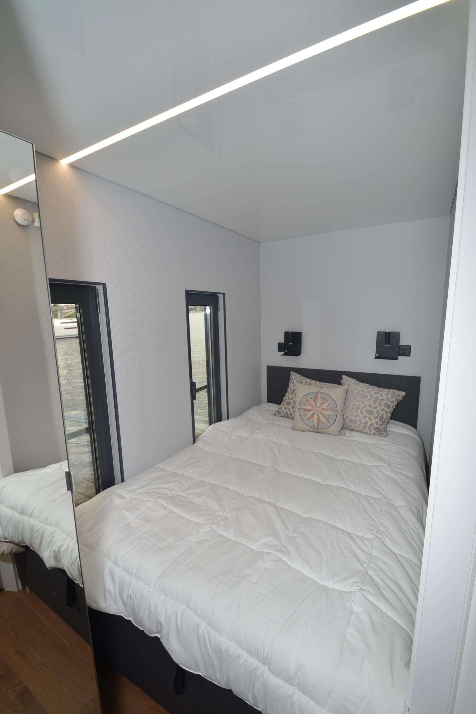 Compact bedroom in 2024 La Mare Modern 11 houseboat with minimalist design.