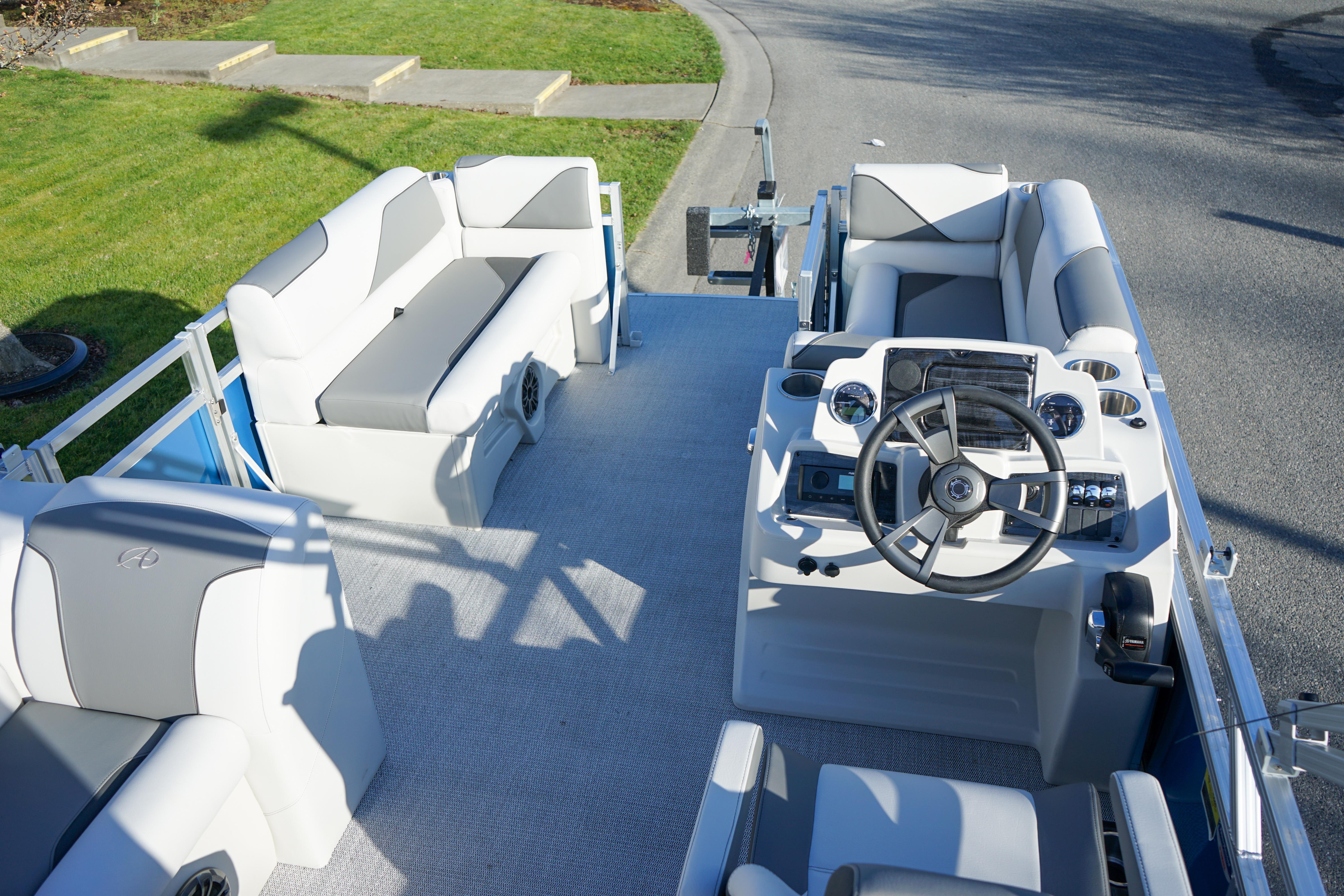2024 Avalon 17 Venture Cruise boat interior with modern seating and steering console.