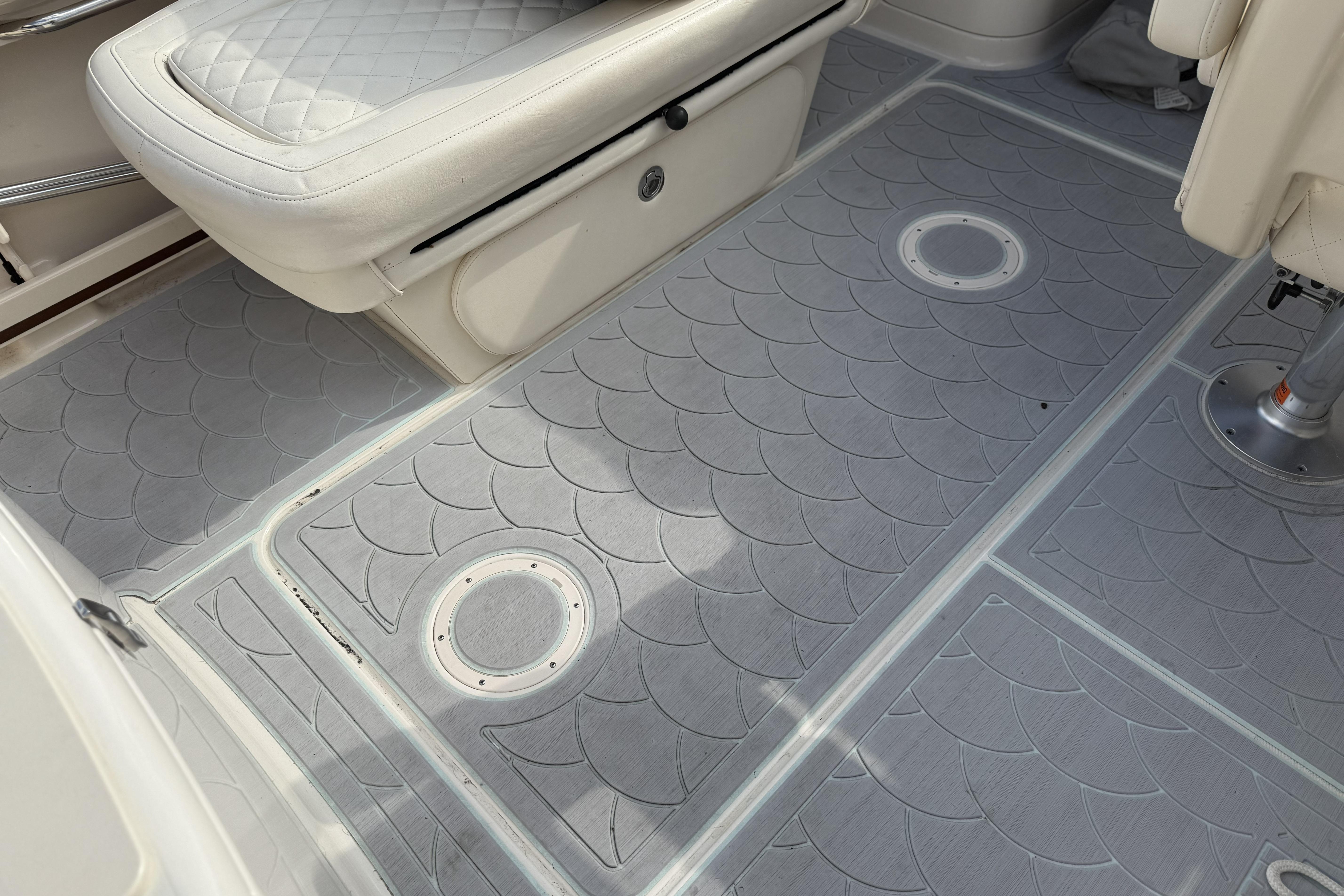 2023 Grady-White Freedom 215 boat interior with quilted seating and textured flooring.