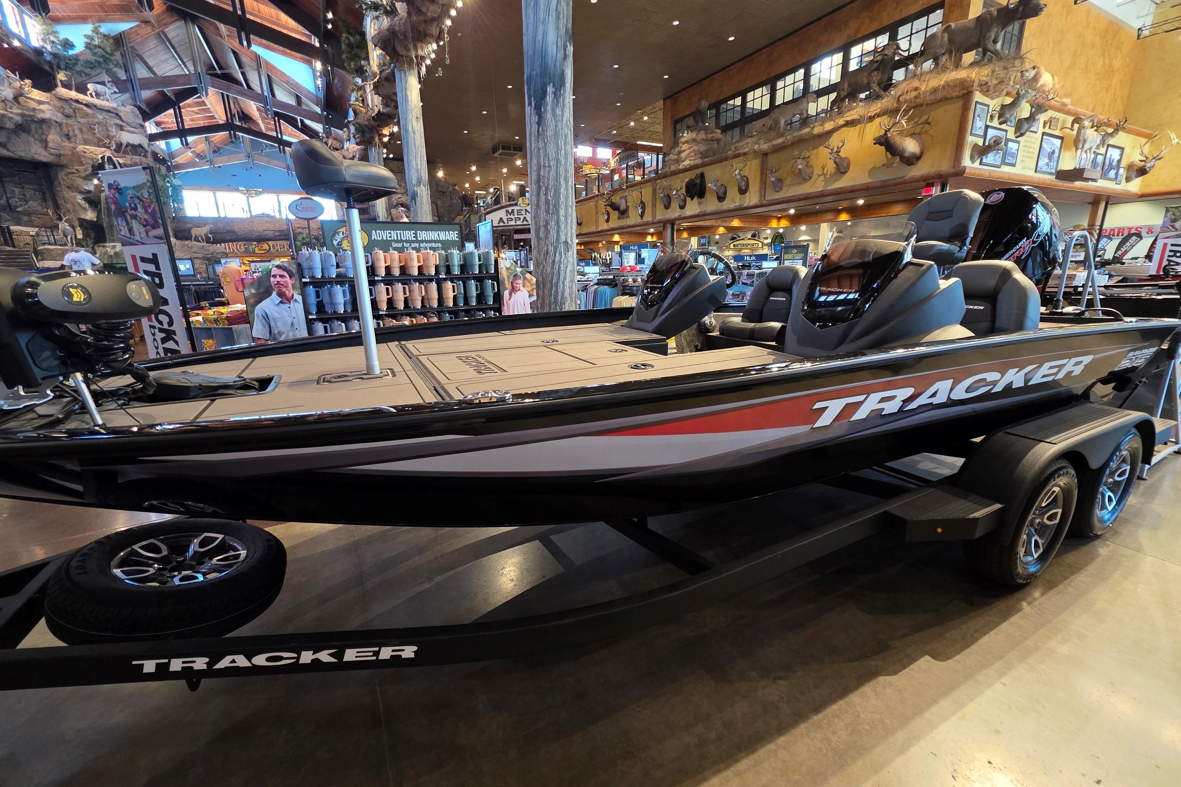 2026 Tracker Savage 215 boat displayed indoors, showcasing sleek design and modern features.