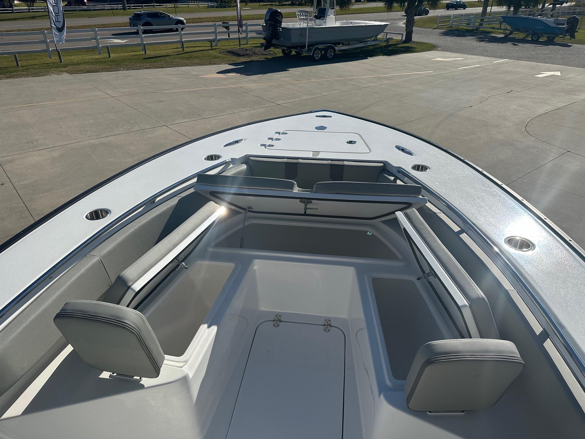 2025 Cape Horn 28XS boat interior with seating and storage compartments.