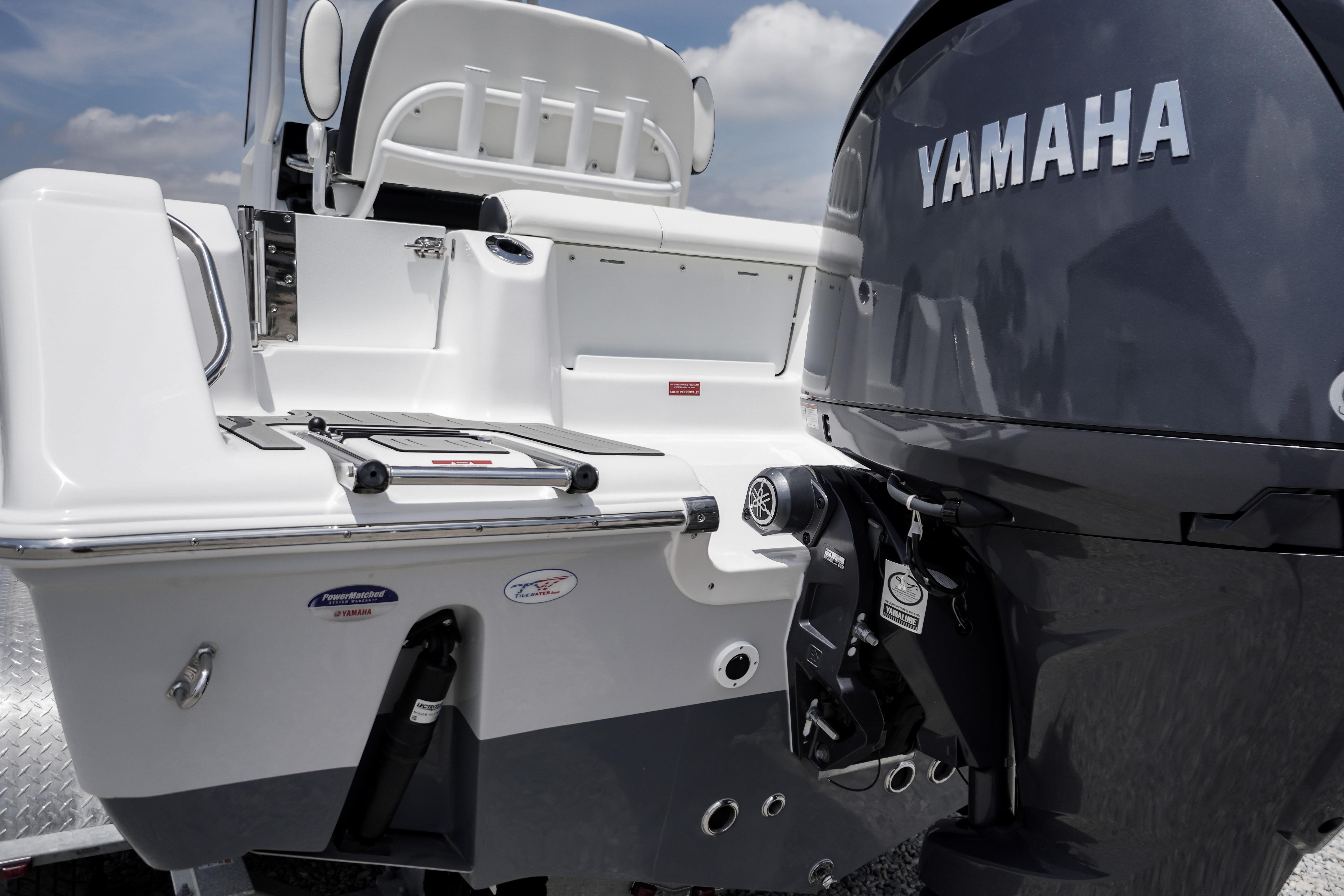 2027 Tidewater 220 CC Adventure boat with Yamaha outboard motor, rear view.