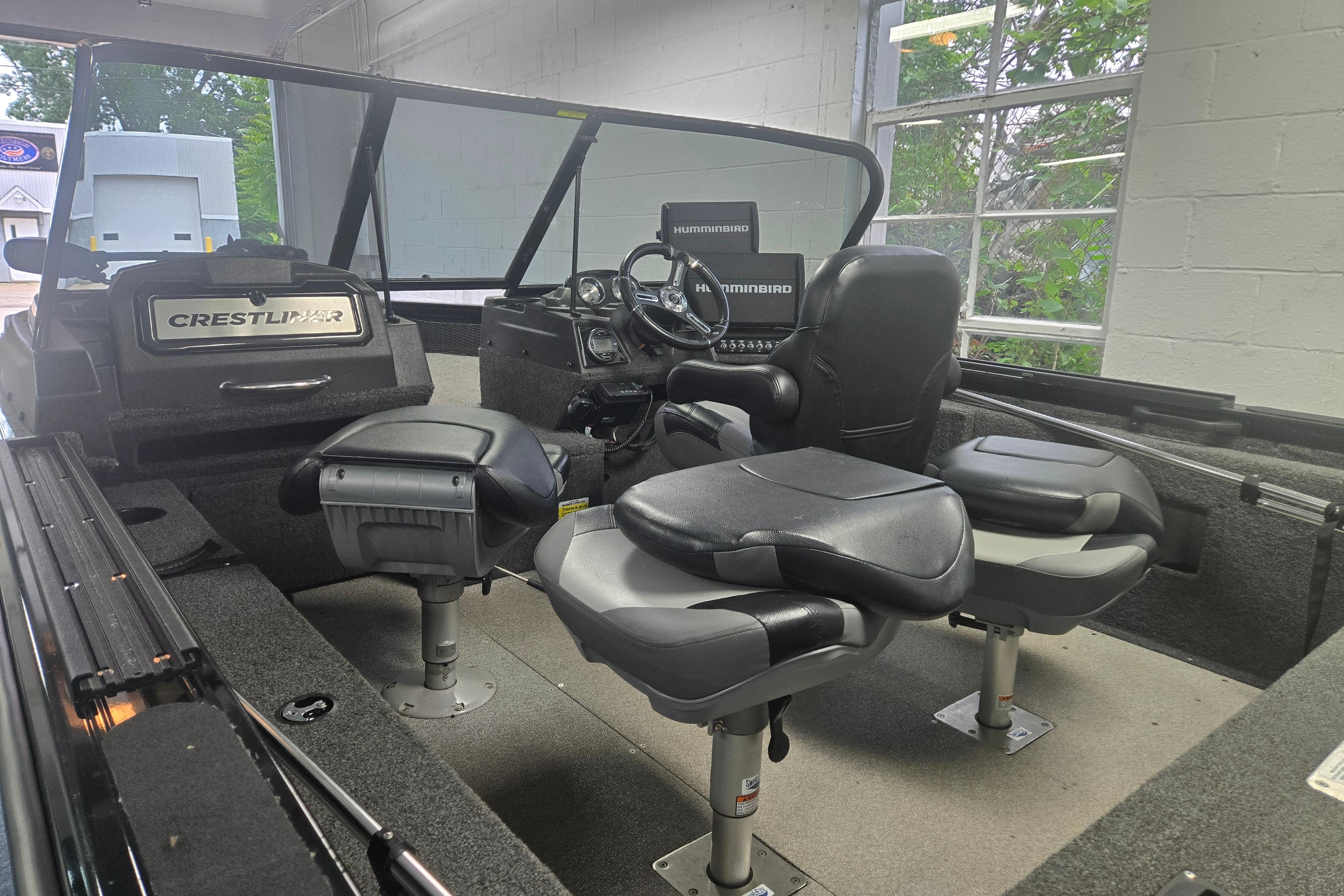 Interior of 2020 Crestliner 1850 Raptor WT boat with seating and control panel.