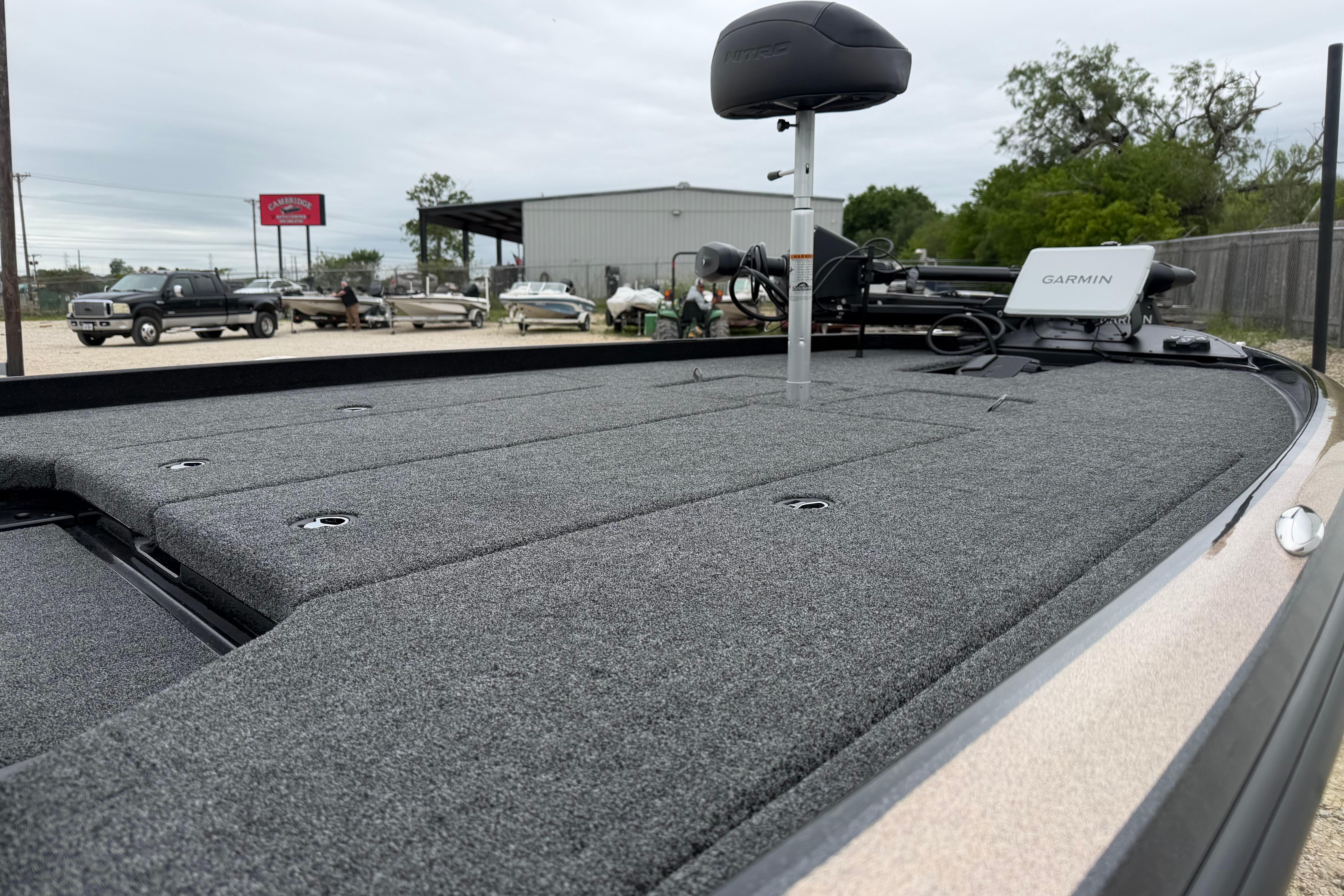 2026 Nitro Z21 XL Pro boat deck with Garmin equipment, parked outdoors.
