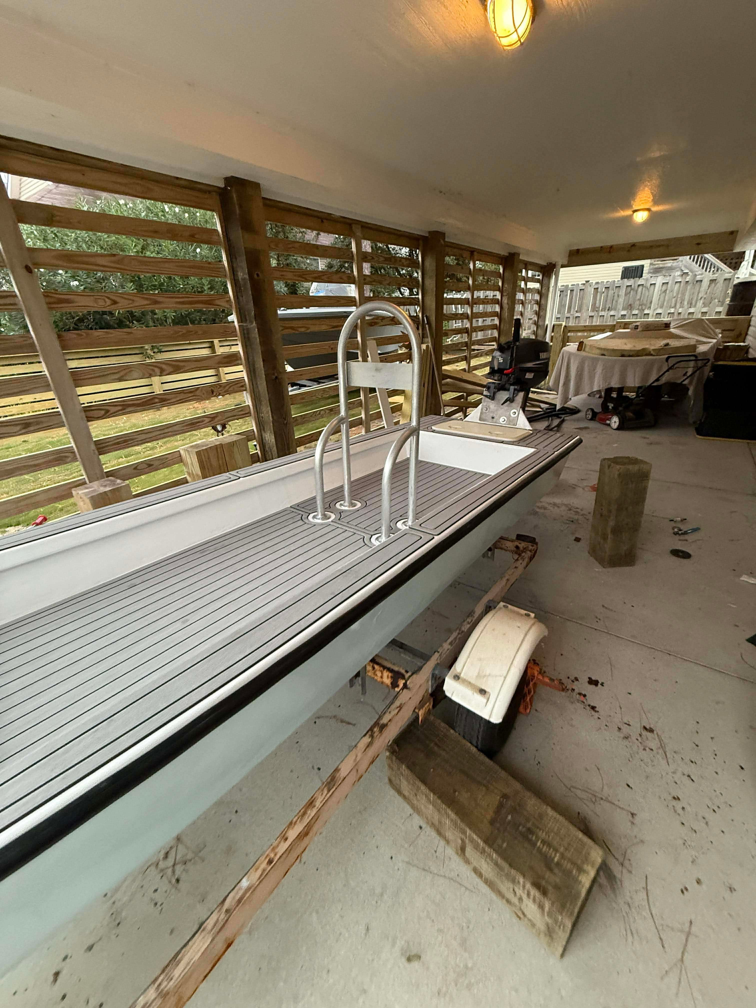 2023 Skiff Craft home-built boat in covered area.