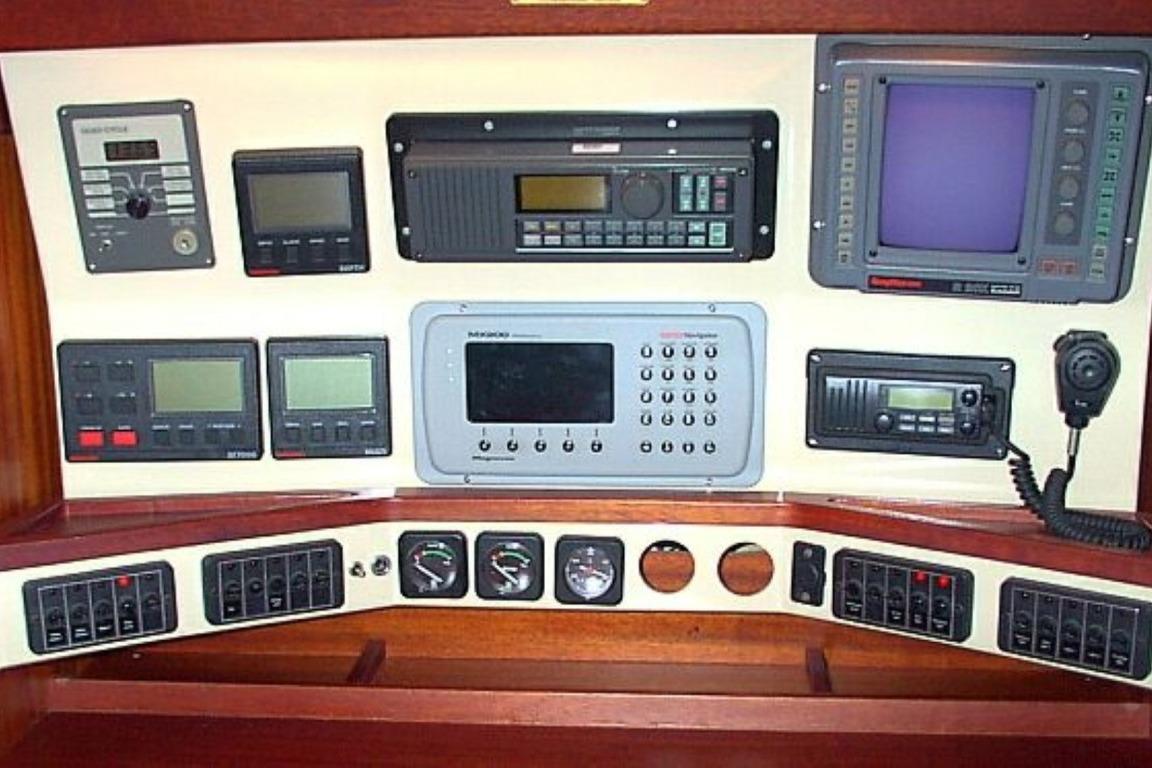 Control panel of a 1985 Sweden Yachts 41, featuring navigation and communication equipment.
