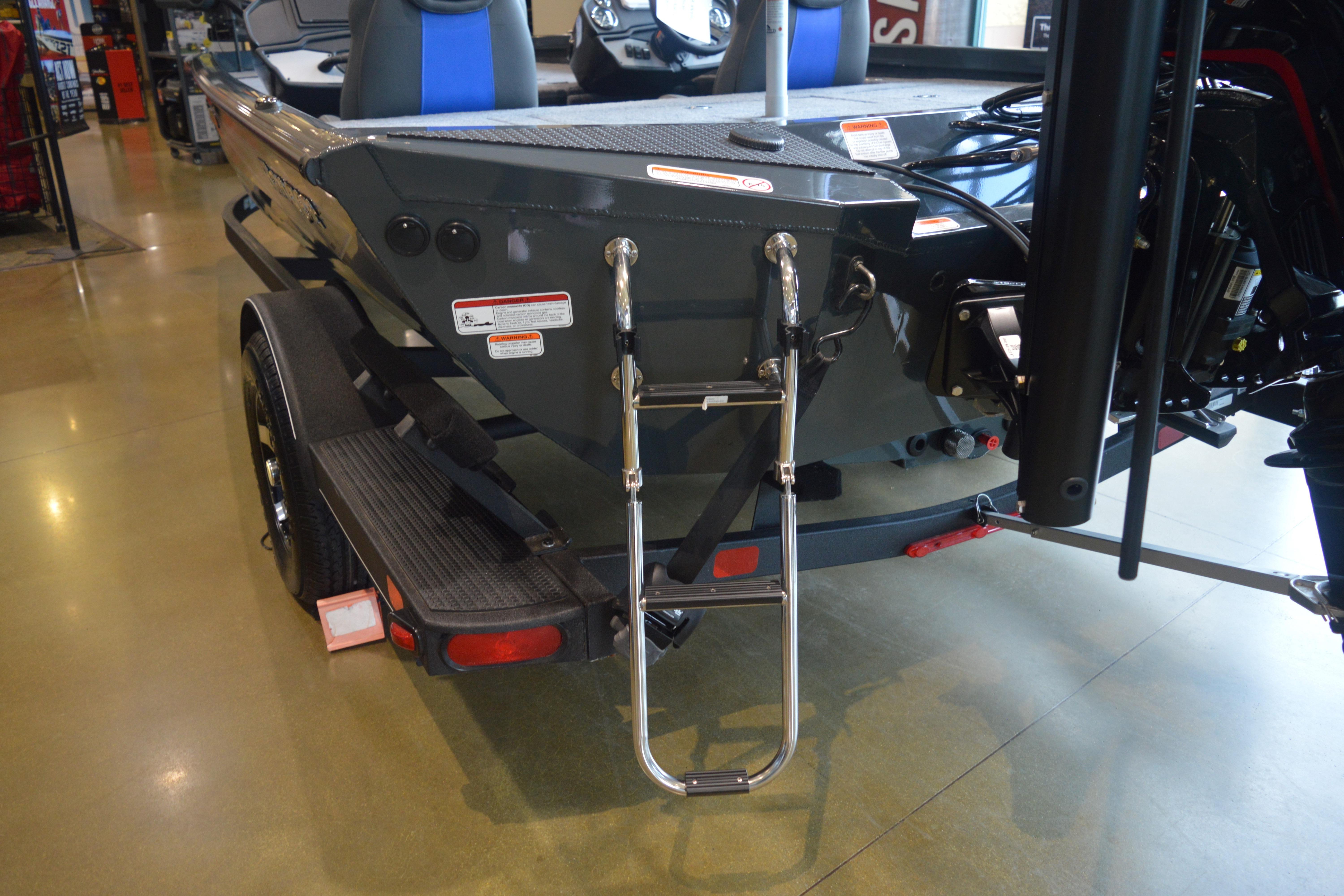 2026 Ranger RT188P boat rear view with ladder and trailer in showroom.