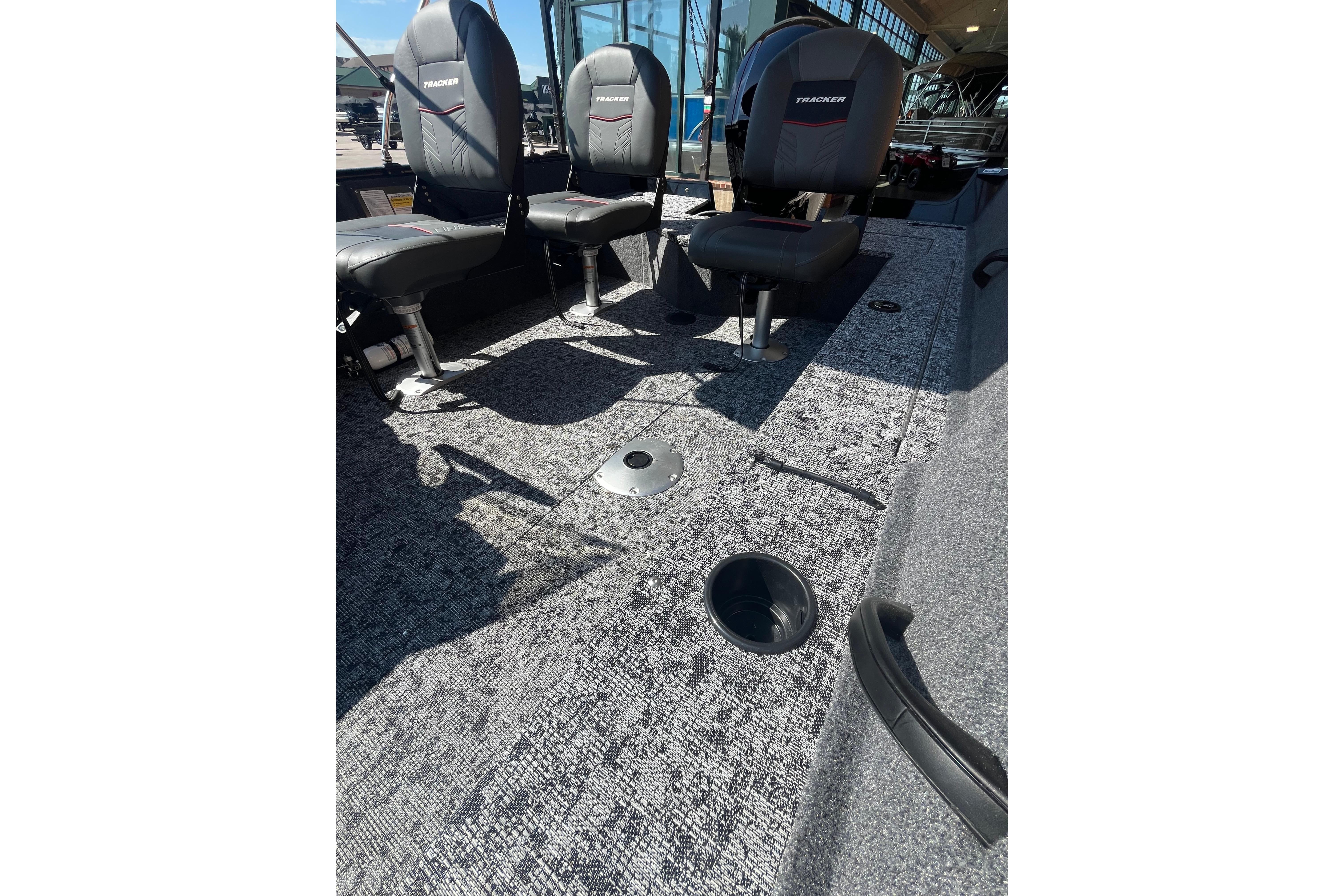 2026 Tracker Pro Guide V-16 SC boat interior with seating and carpeted flooring.