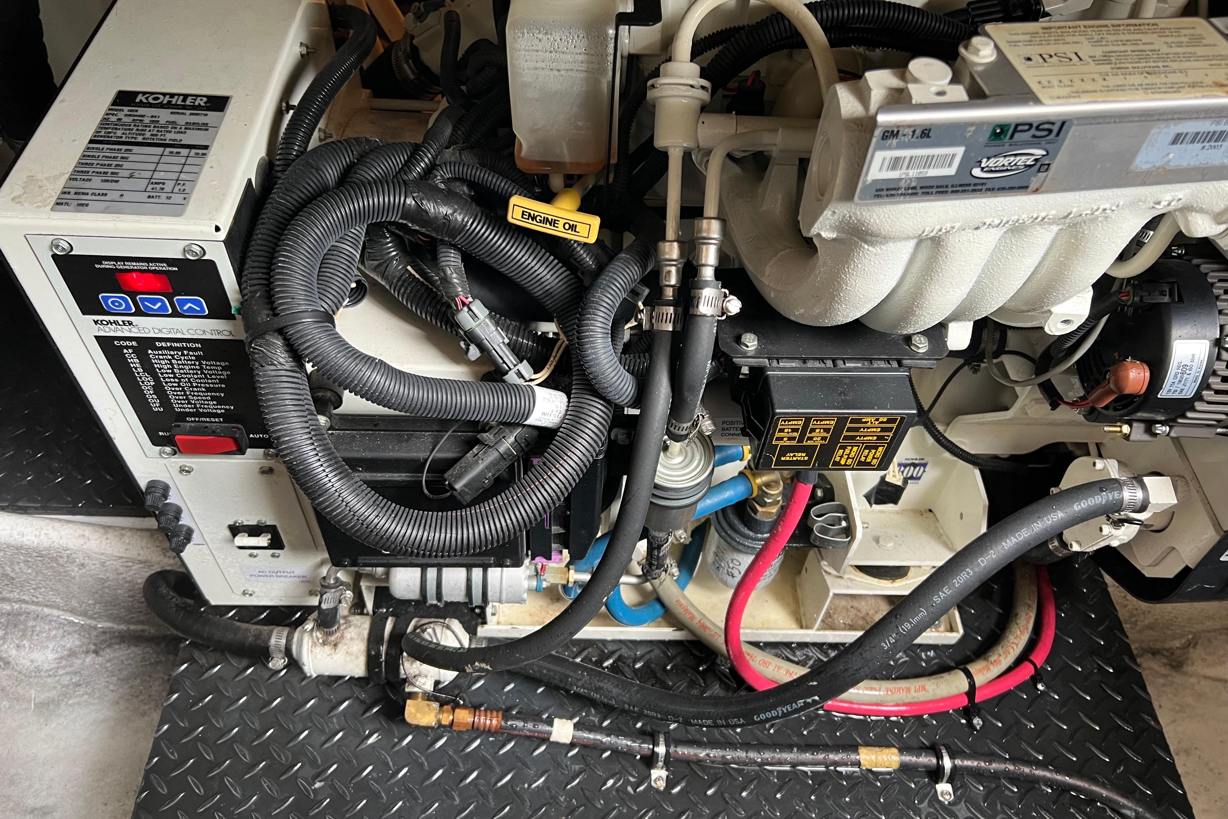 Engine compartment of a 2006 Silverton 38 Sport Bridge with Kohler generator and wiring.