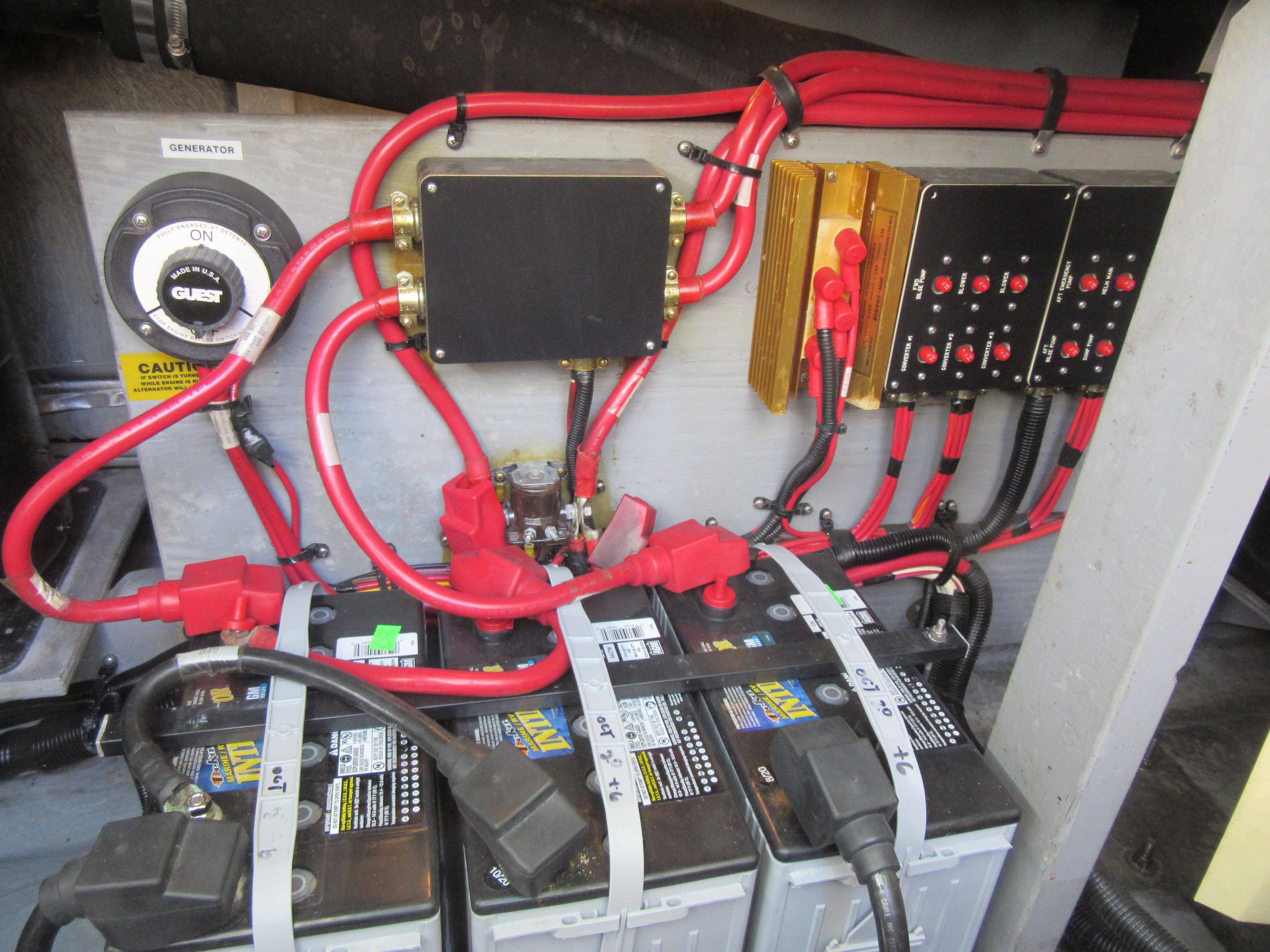 Electrical system of a 1995 Sea Ray 400 Express Cruiser with batteries and wiring.