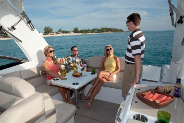 Manufacturer Provided Image: People relaxing on a 2013 Formula 350 Sun Sport boat, enjoying drinks and snacks.