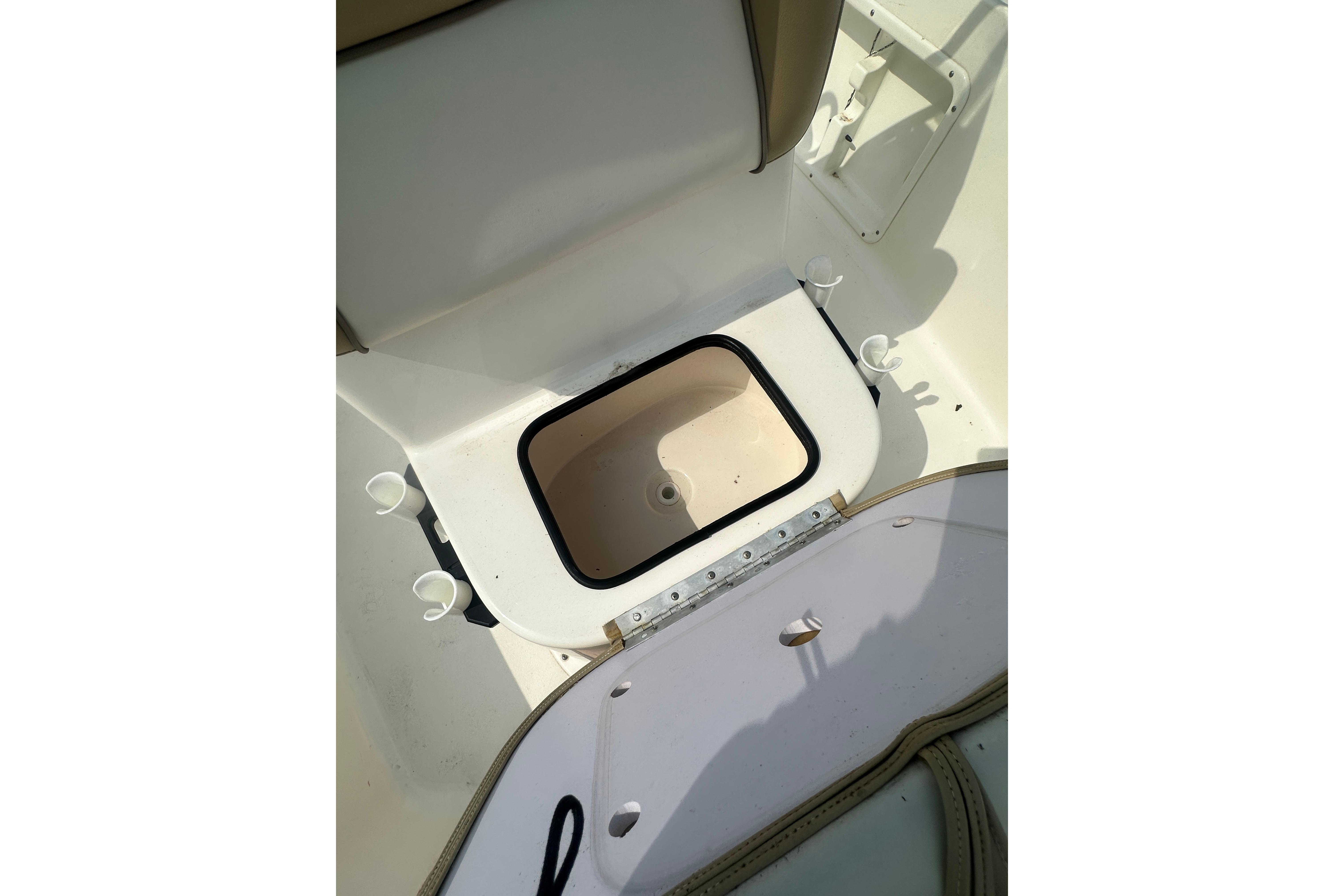 2018 Key West 1720 Center Console boat interior with open storage compartment.