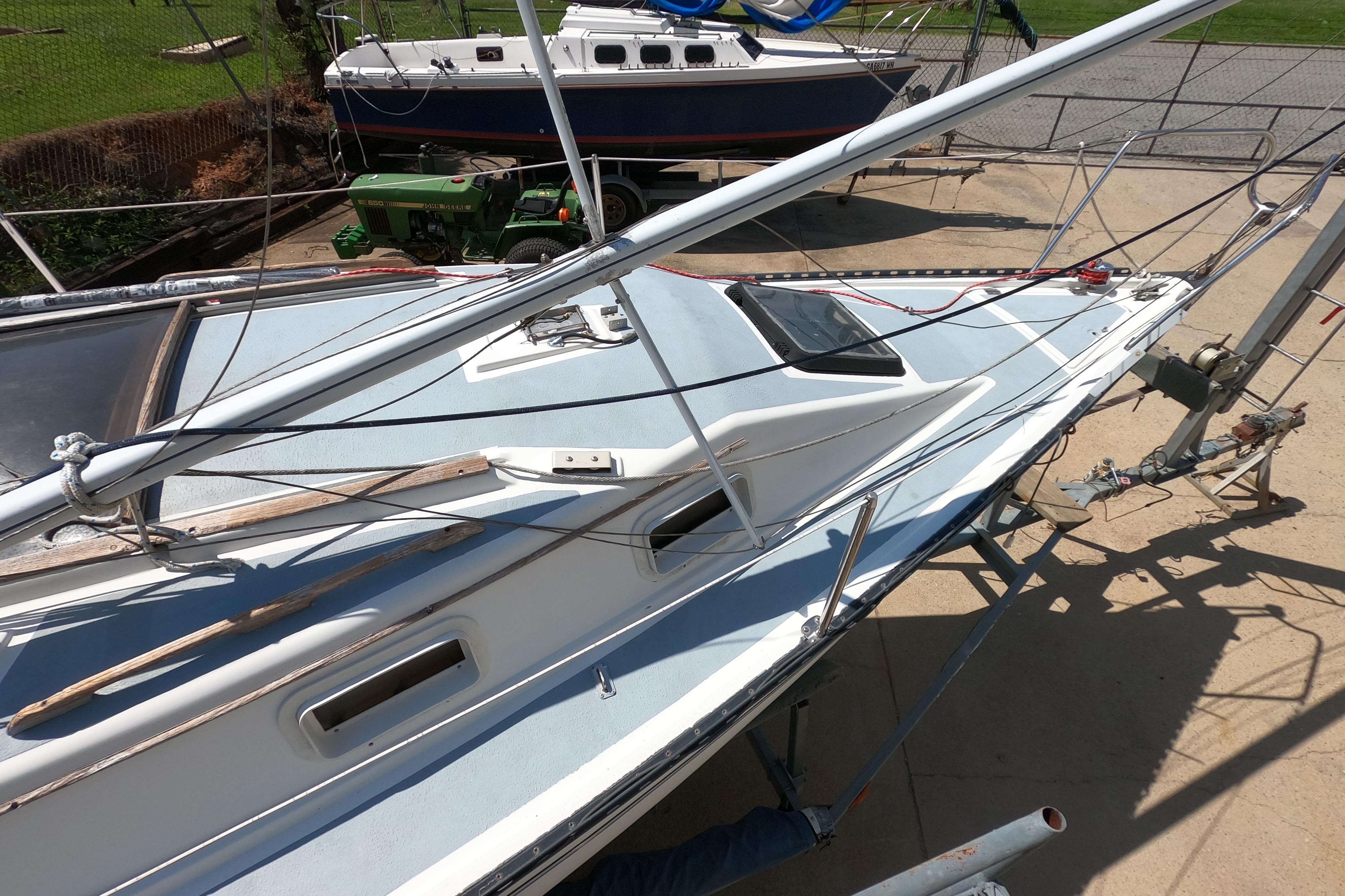 1984 Hunter 22 sailboat on trailer, with visible deck and rigging, parked outdoors.
