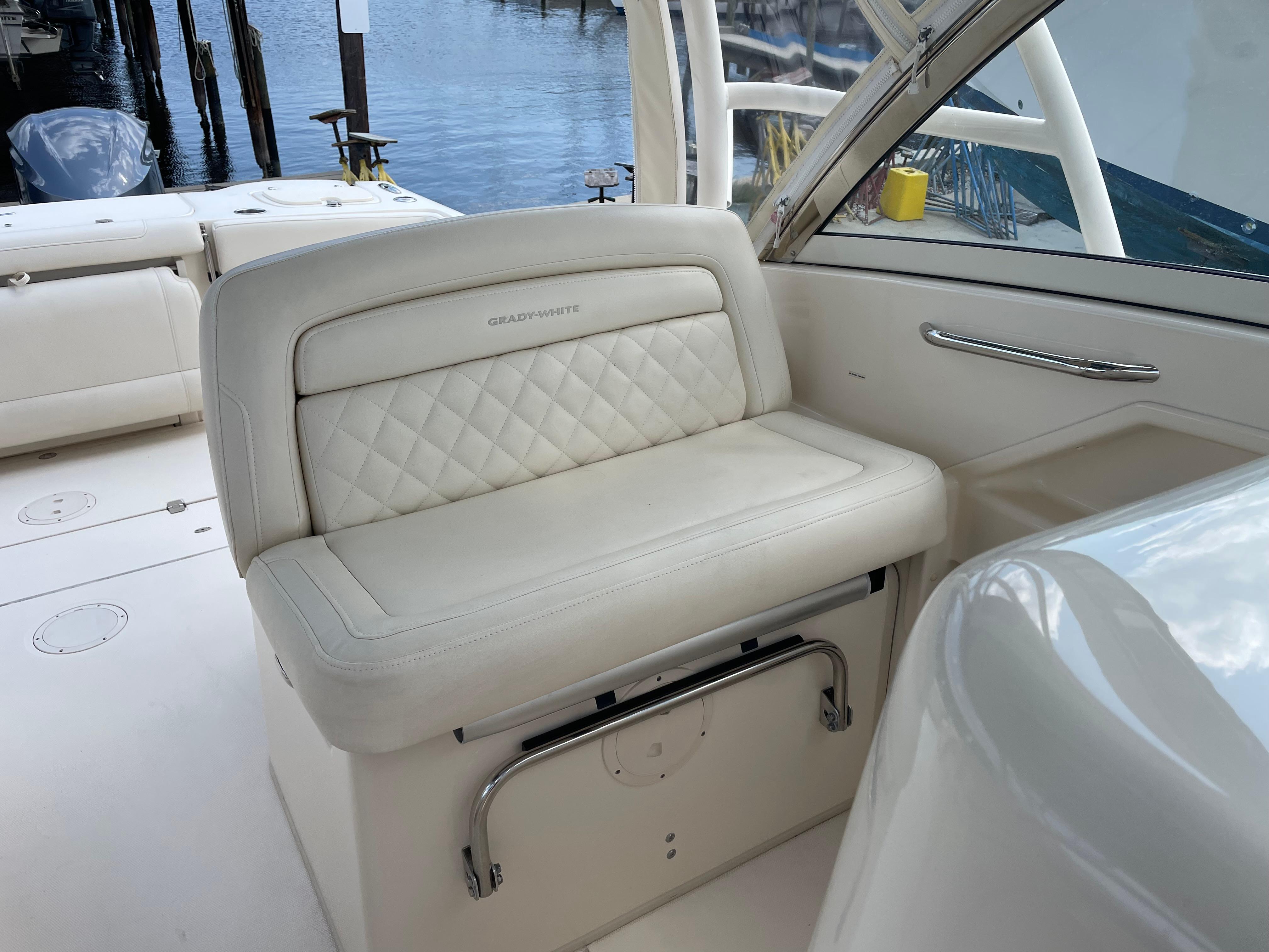 2019 Grady-White Freedom 325 boat interior with white cushioned seating.