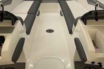 2025 Tahoe T21 boat interior with gray seating and storage compartments.