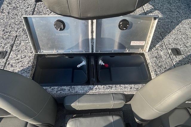 2026 Tracker Pro Team 195 boat storage compartments with open lids and seating.