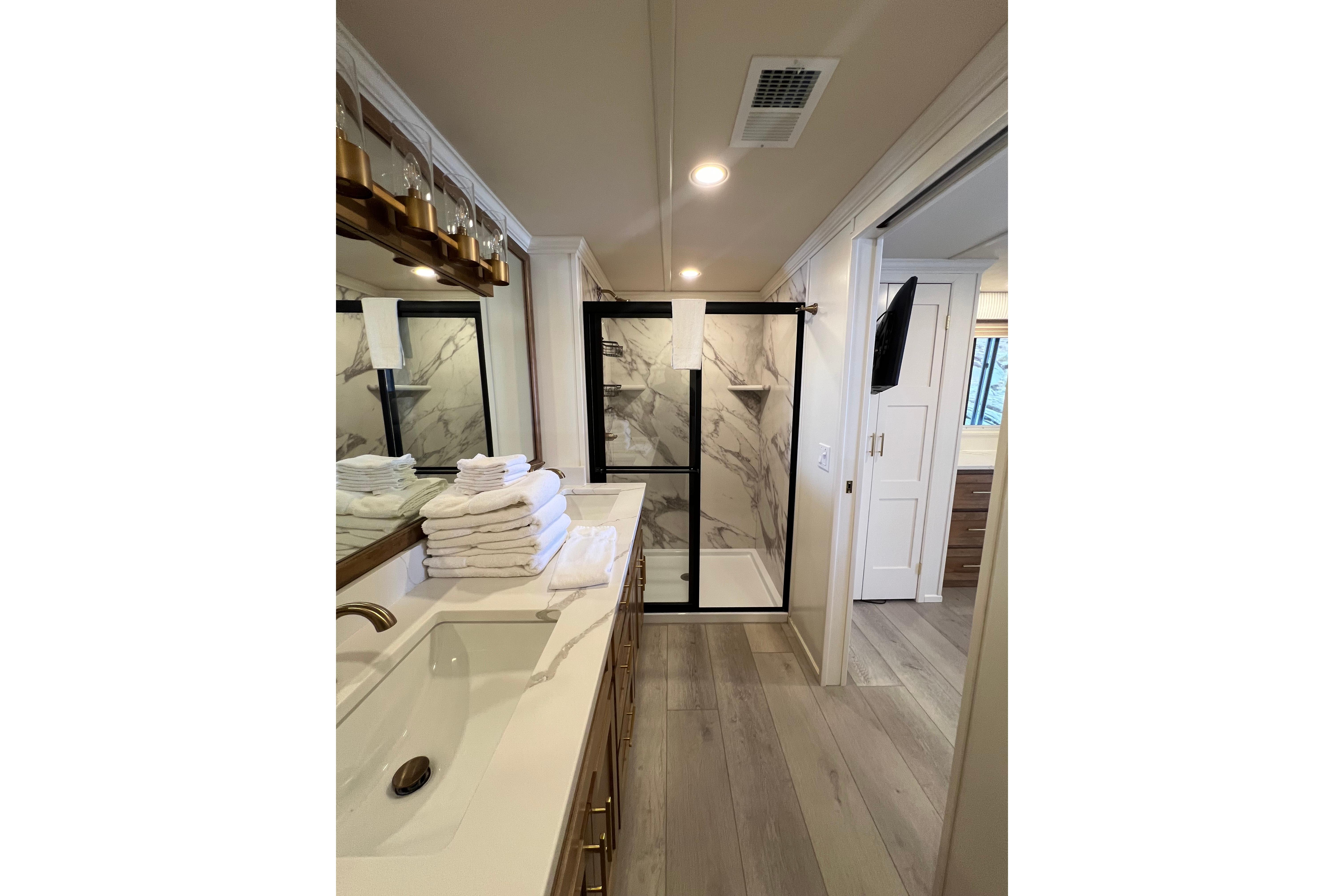 Luxurious bathroom in 2025 Sumerset Excellence Multiple Shares houseboat, featuring modern fixtures and elegant design.