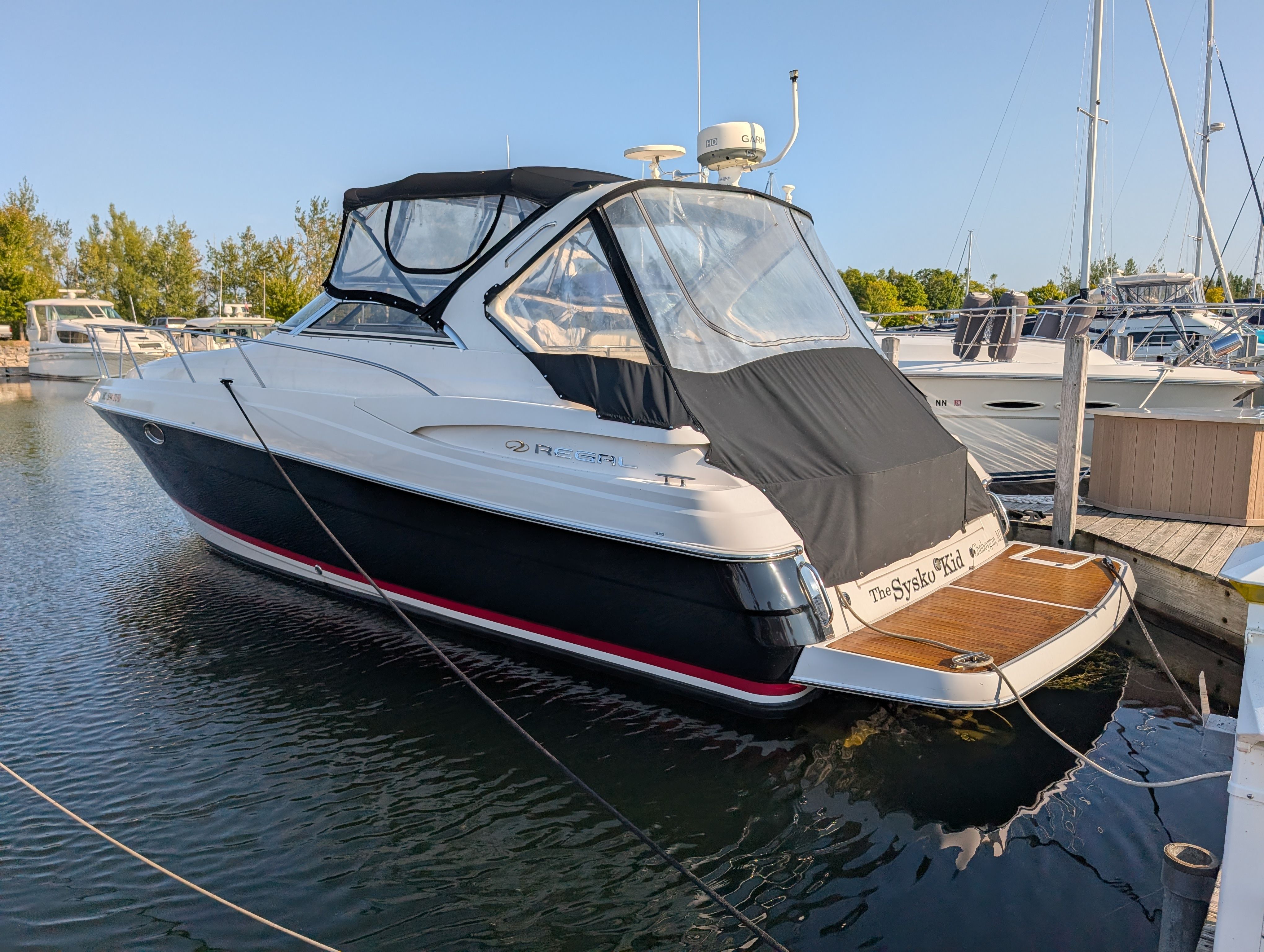 2005 Regal Commodore 3560 yacht docked at marina.