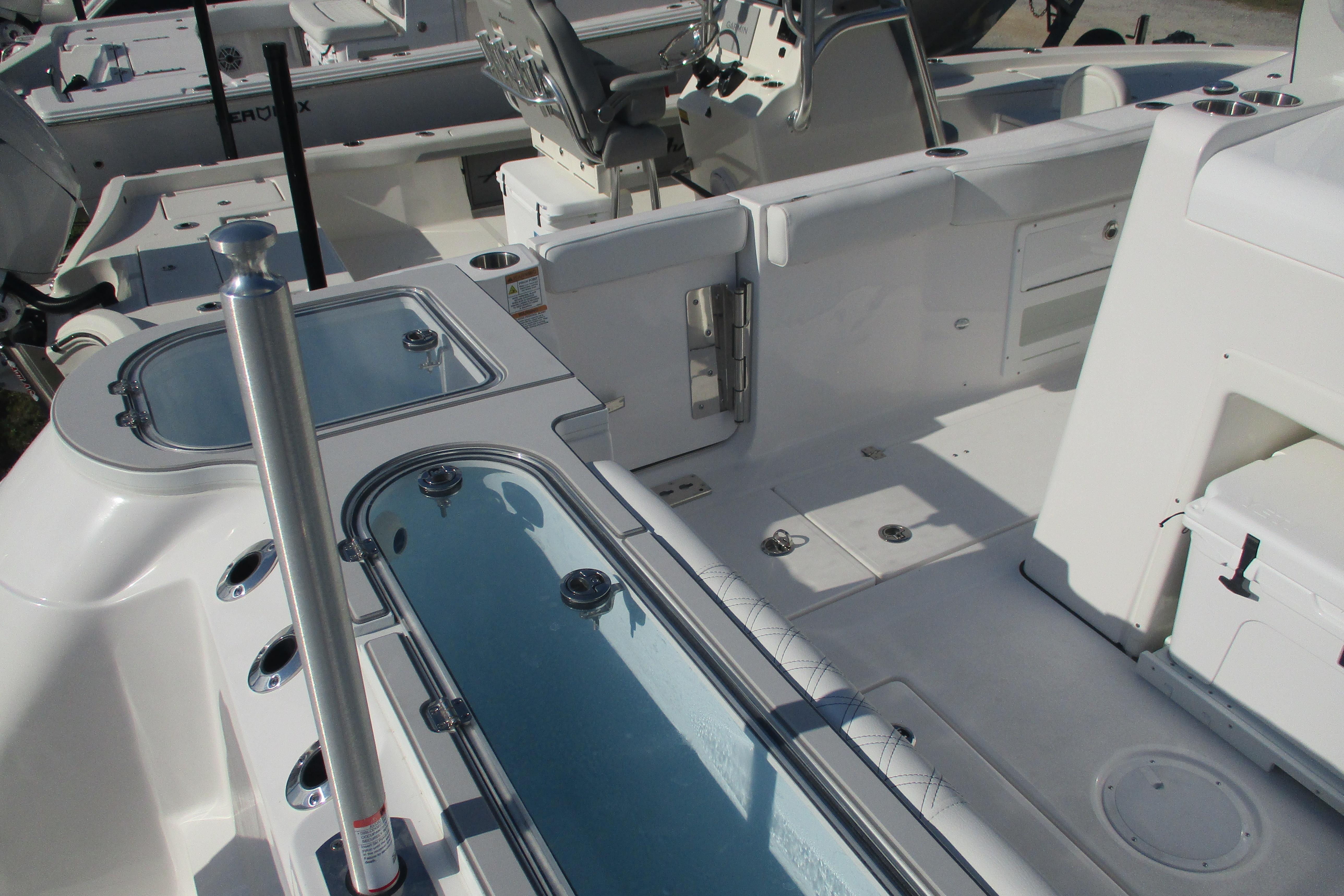 2026 Sea Fox 328 Commander boat interior with seating and storage compartments.