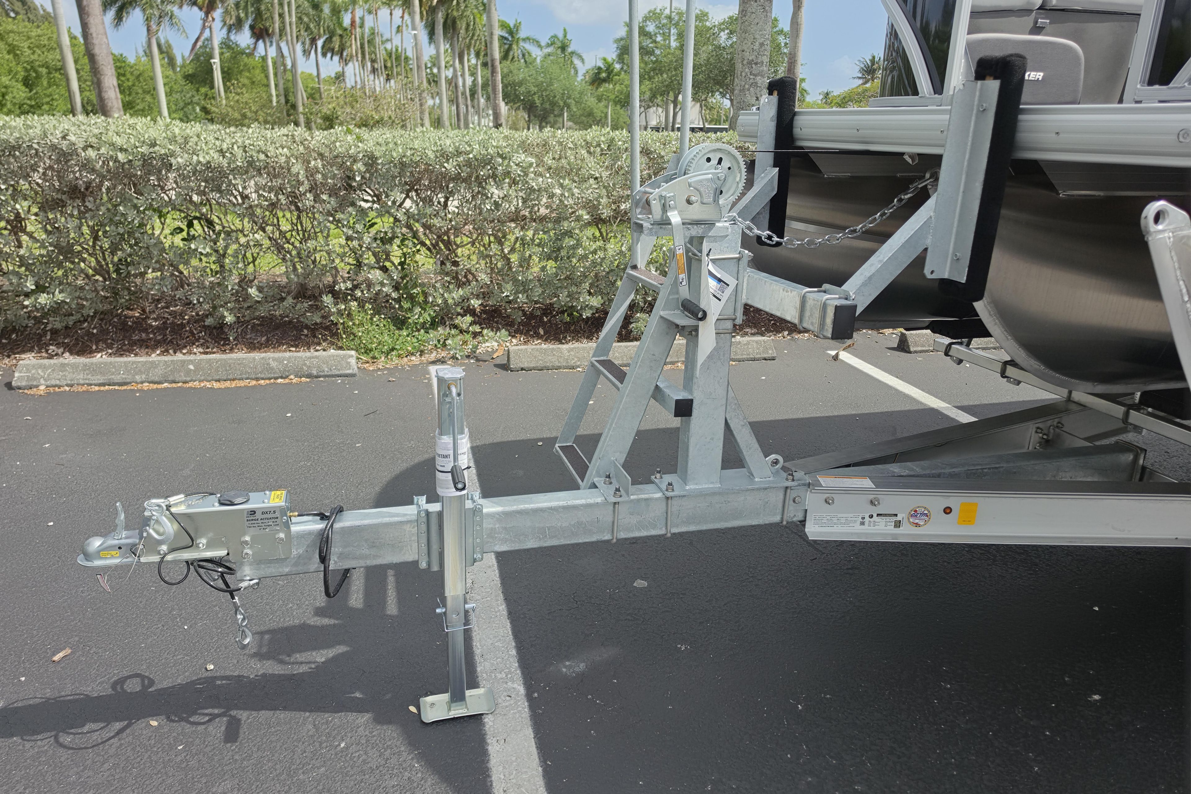 Trailer hitch of 2026 Sun Tracker Party Barge 24 XP3 in parking lot.