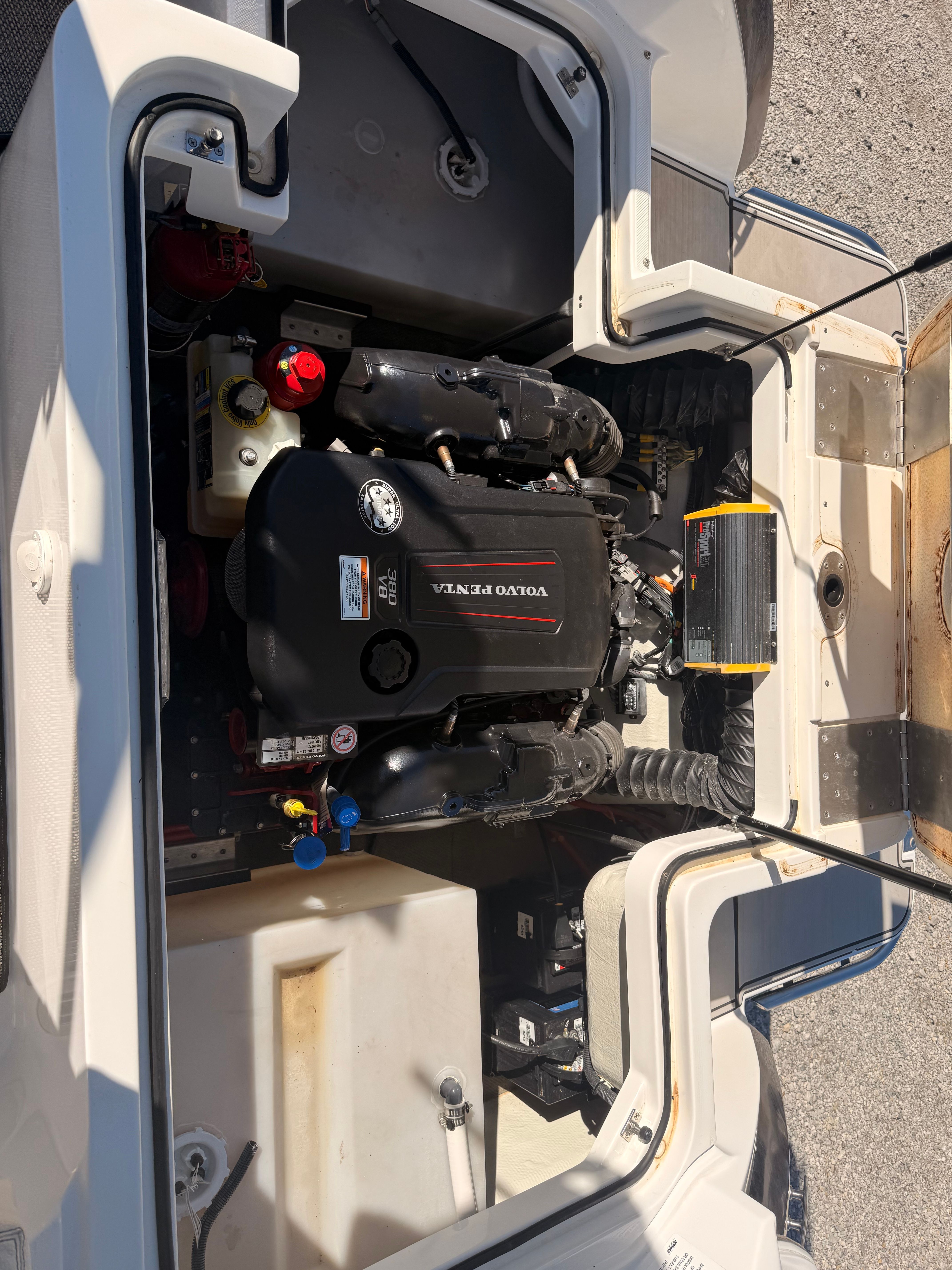 The engine compartment of a 2019 Cobalt R7 Surf boat with a Volvo Penta engine.