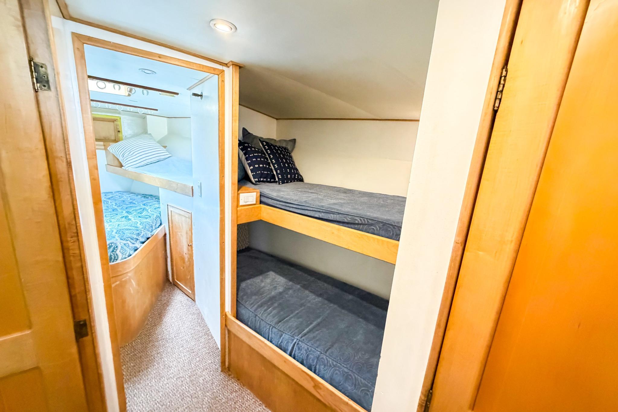 Interior of 1998 Blackwell Custom Carolina Sportfish with cozy bunk beds and wooden accents.