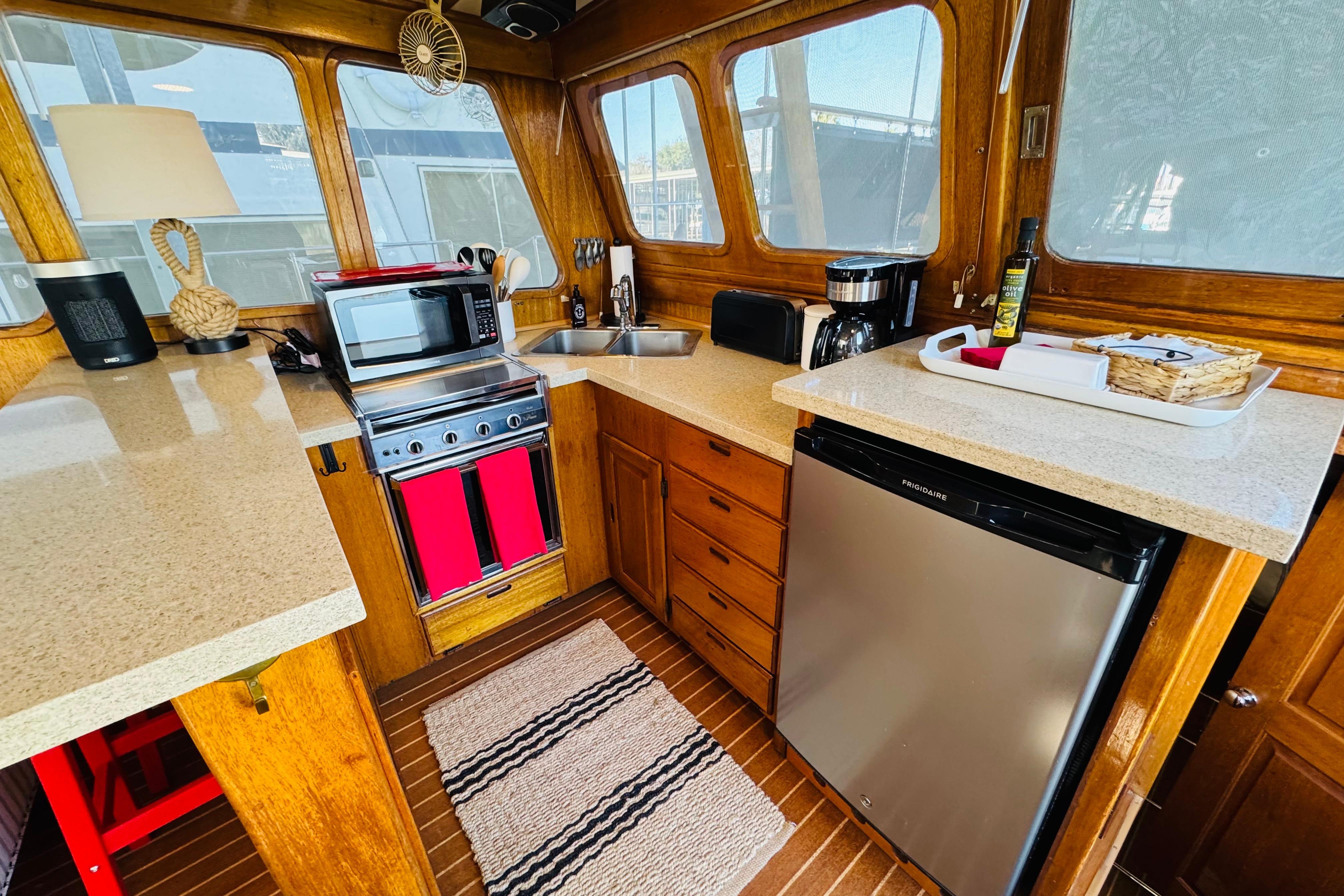 1978 Californian 42 LRC yacht kitchen with modern appliances and wooden cabinetry.