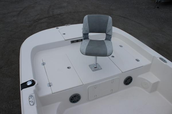 2025 Carolina Skiff 23 LS boat deck with swivel chair and storage compartments.