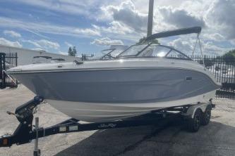 2017 Sea Ray SPX 210 Outboard boat on trailer under cloudy sky.