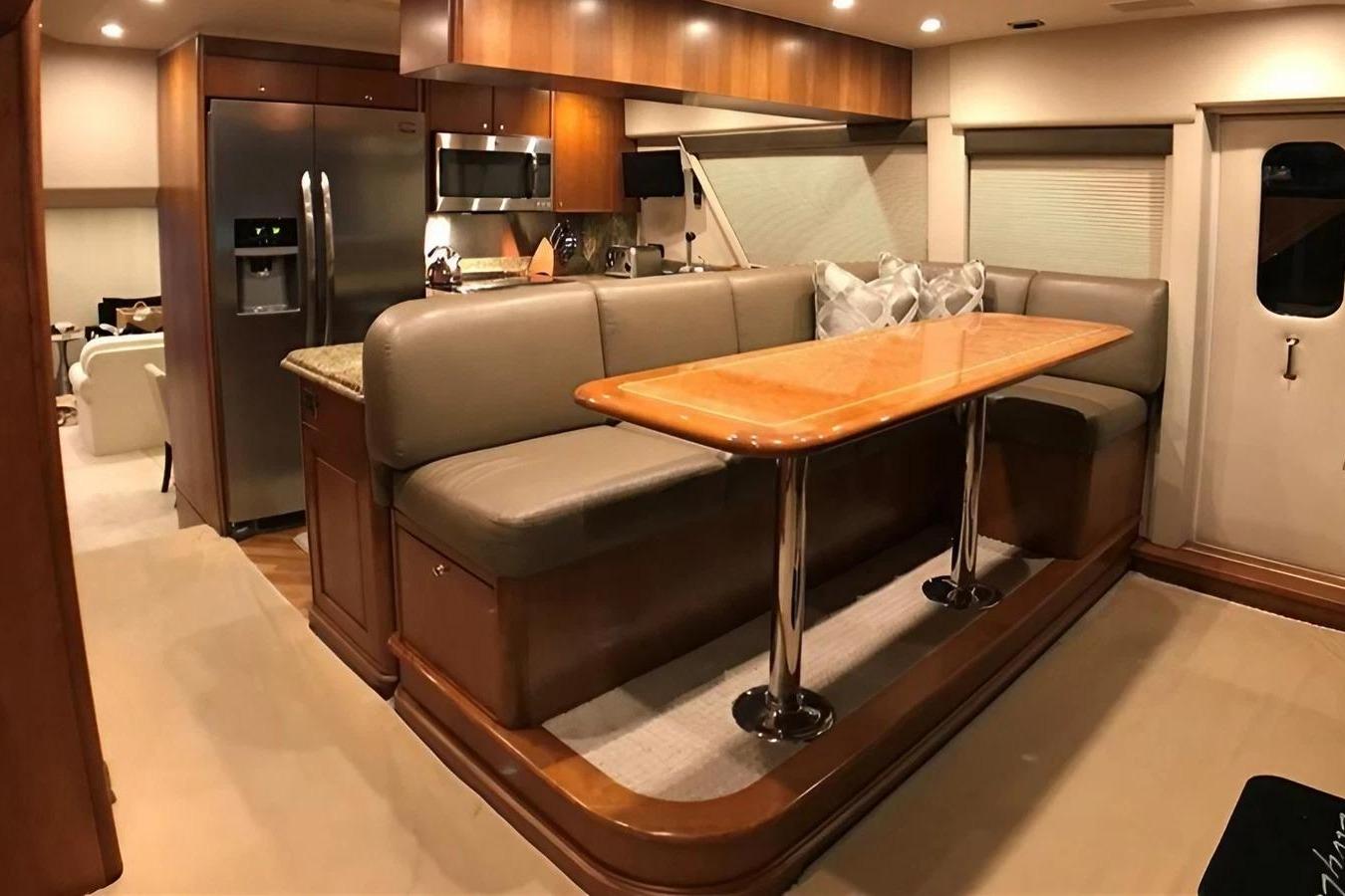 Luxurious interior of a 2005 Pacific Mariner Raised Pilothouse Motor Yacht with dining area.