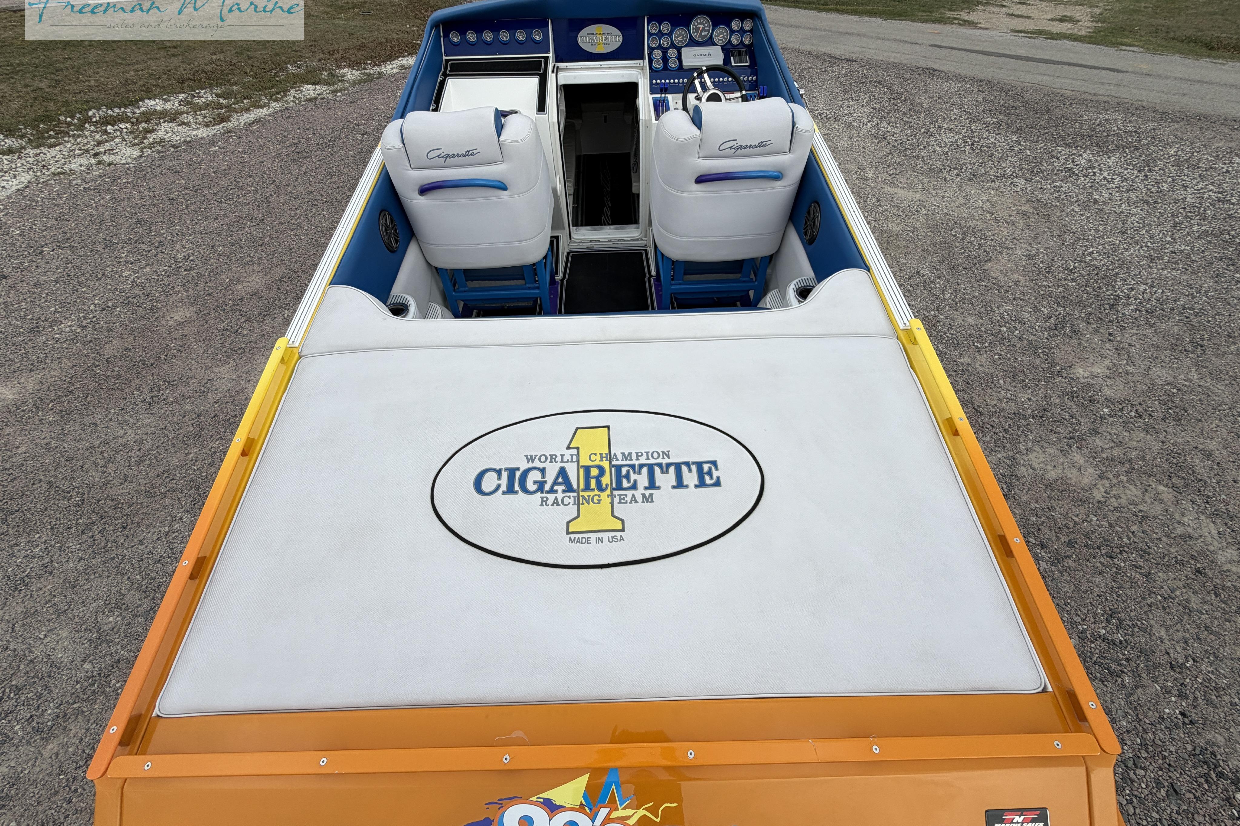 2000 Cigarette 30' Mystique boat interior with branded seating and dashboard.