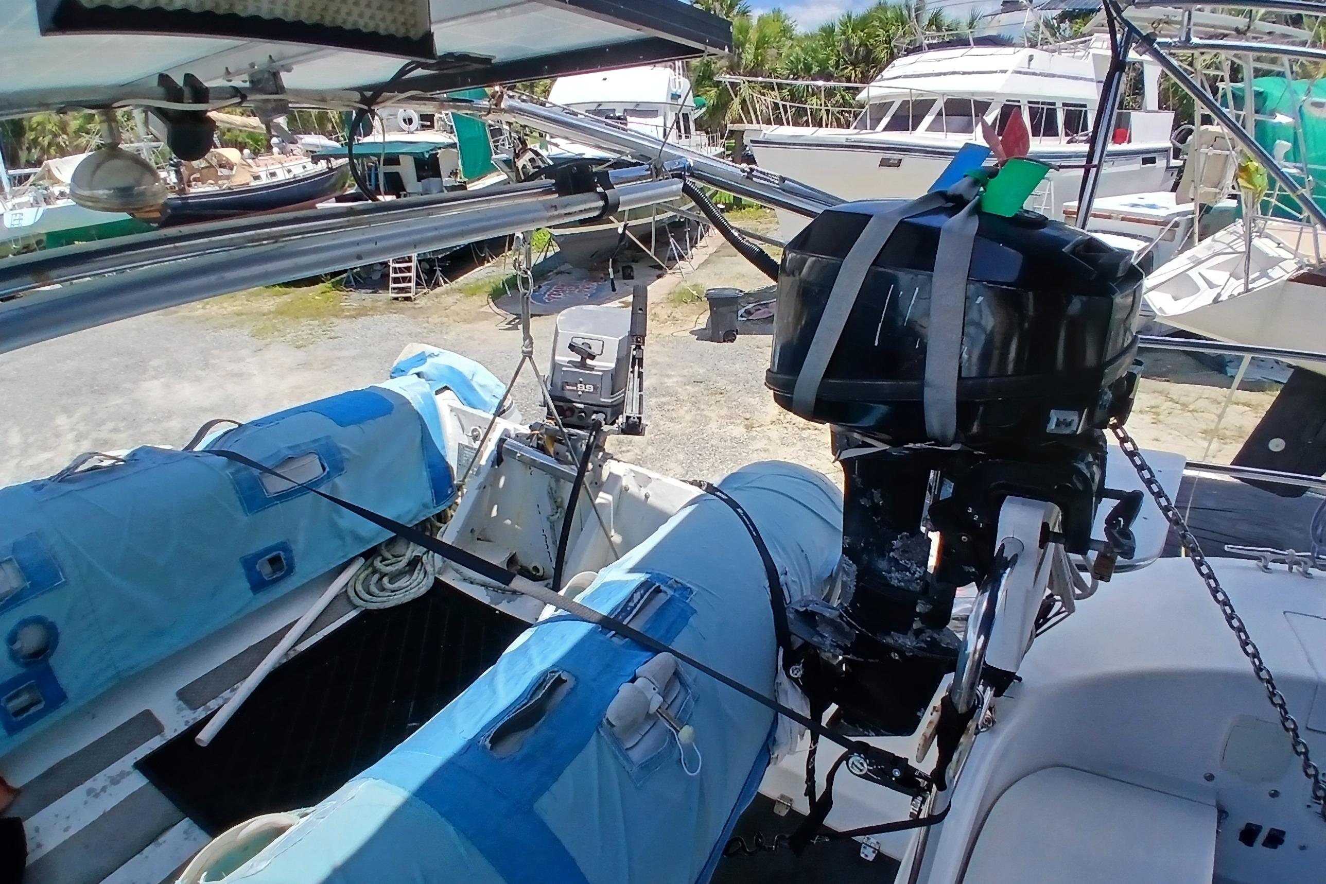 Catalina 42 MkII sailboat deck with outboard motor and covered equipment, 1995 model.