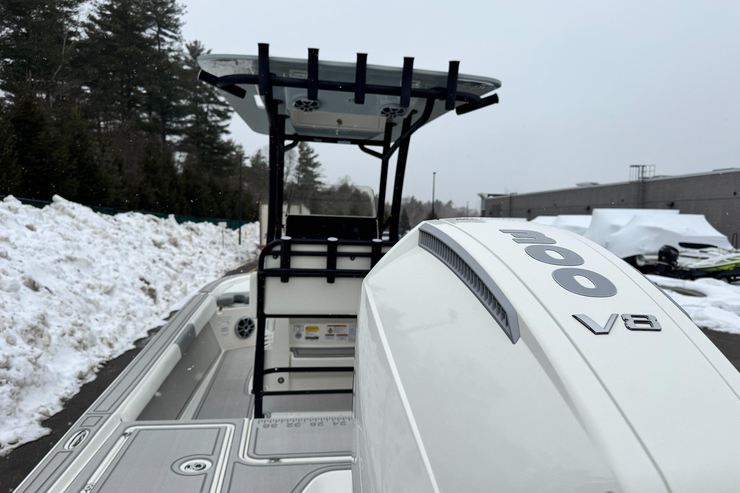 2026 Mako 24 APEX boat with 300 V8 engine, snowy background.