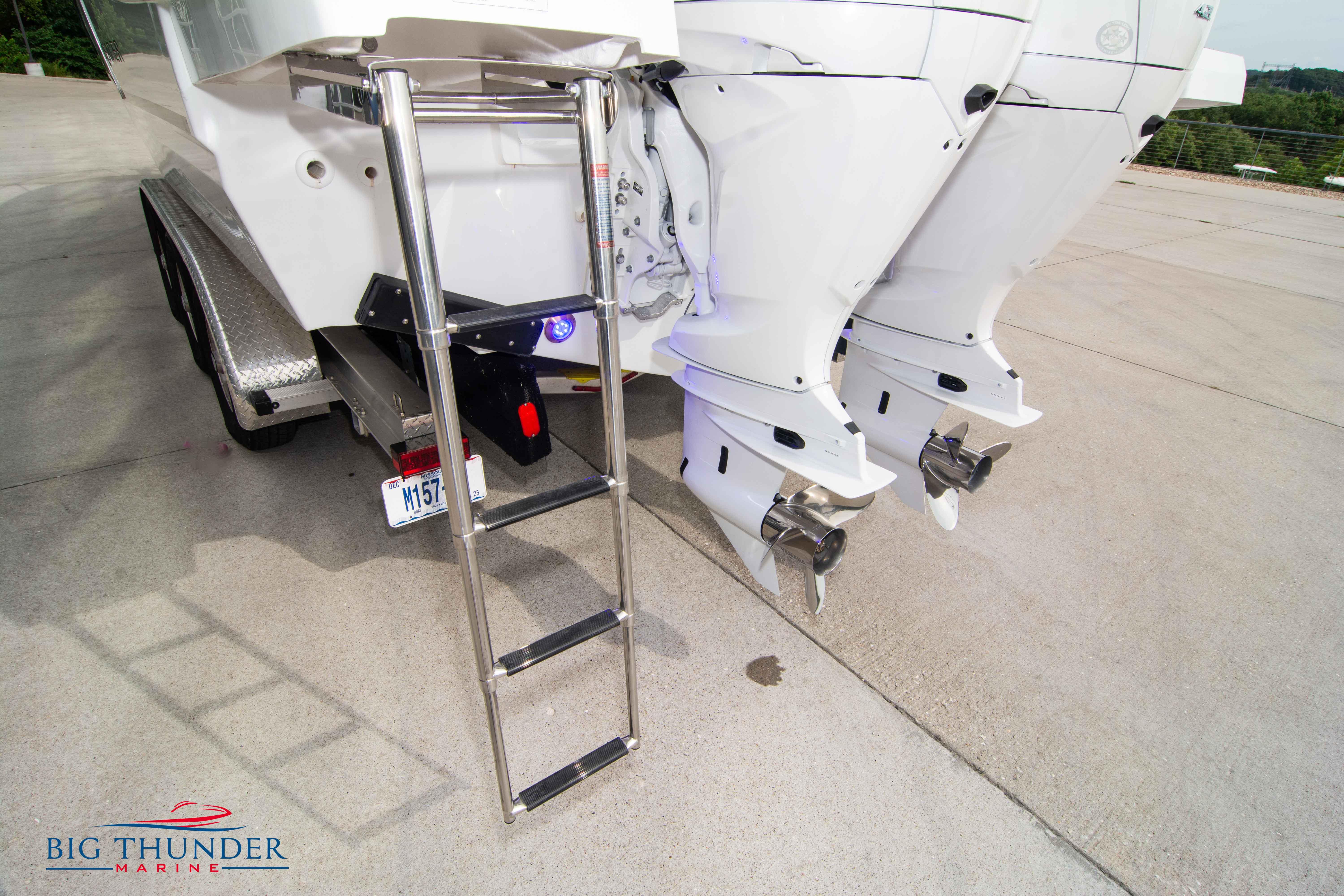 2024 Jeanneau Leader 9.0 WA boat with dual outboard motors and boarding ladder.