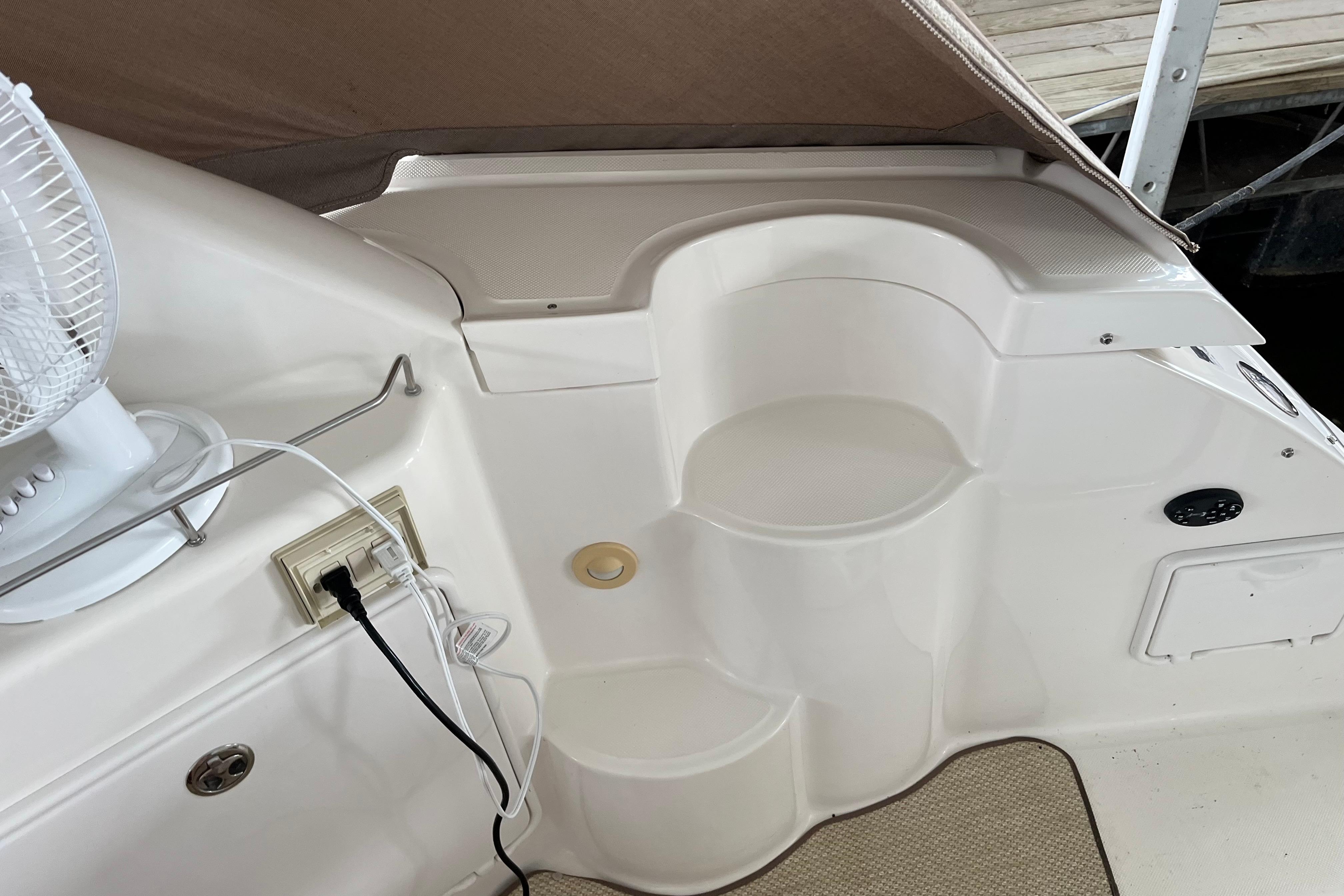2007 Regal 3760 IB Commodore boat interior with steps and electrical outlet.