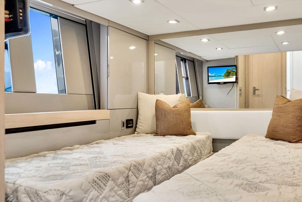 Luxurious 2012 Fairline Targa 58 yacht cabin with twin beds and modern decor.