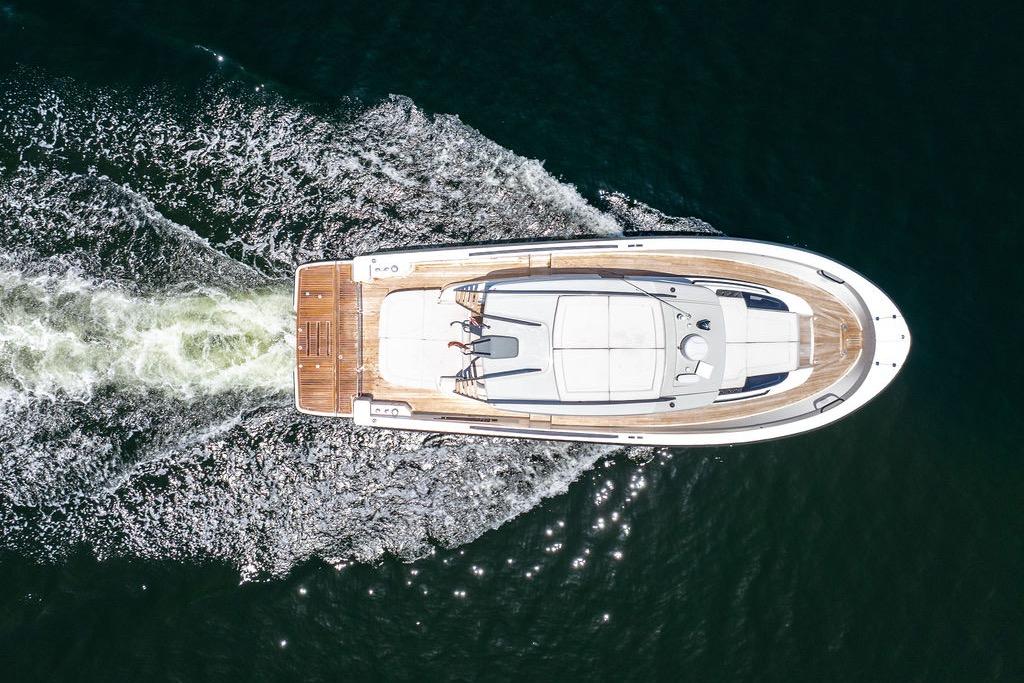 Aerial view of 2021 Bluegame BG 42 yacht cruising on water.