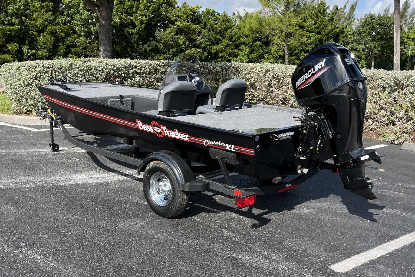 2026 Tracker Bass Tracker Classic XL boat with Mercury engine in a parking lot.