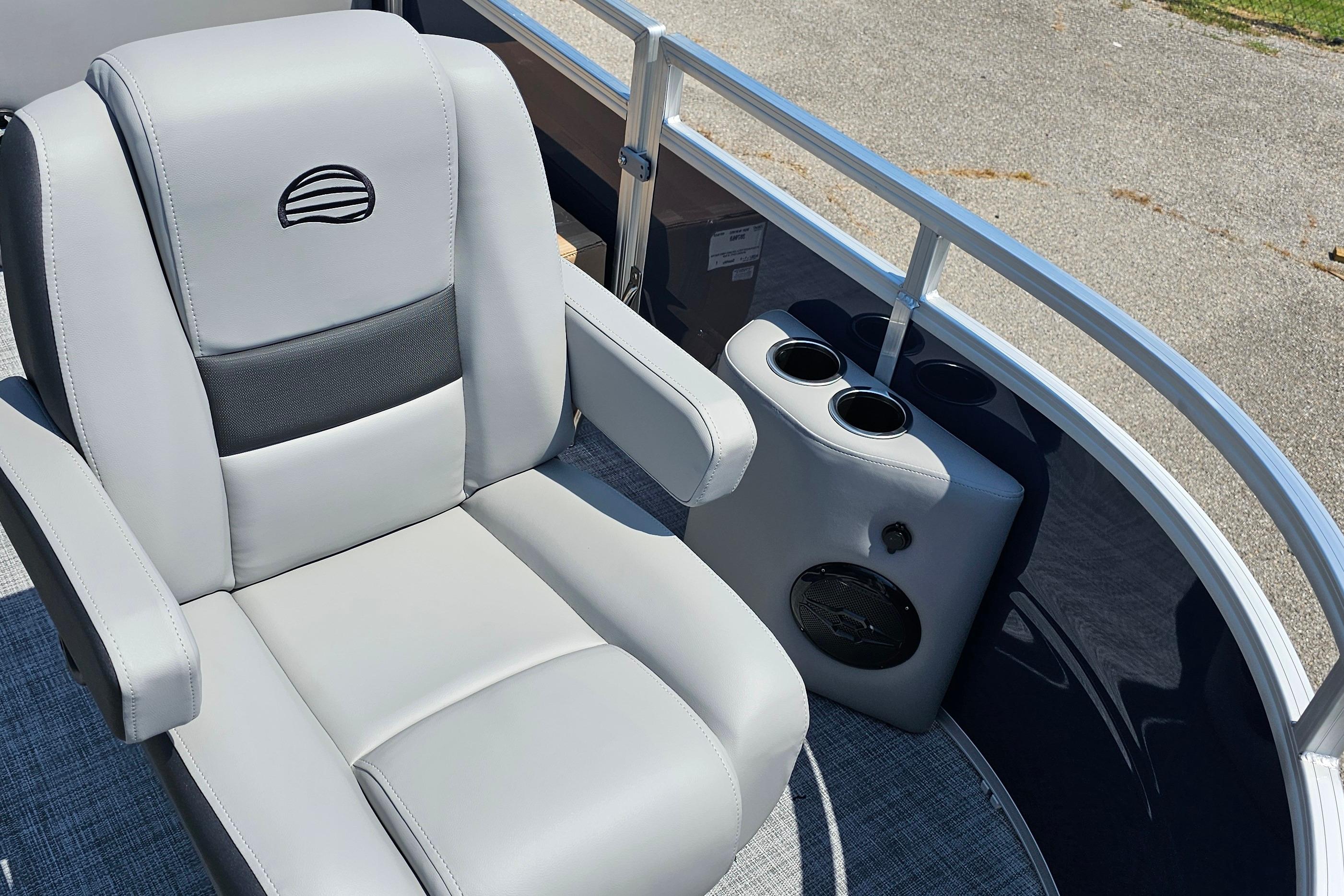 2026 Sun Tracker SportFish 20 DLX boat seat with cup holders and speaker.