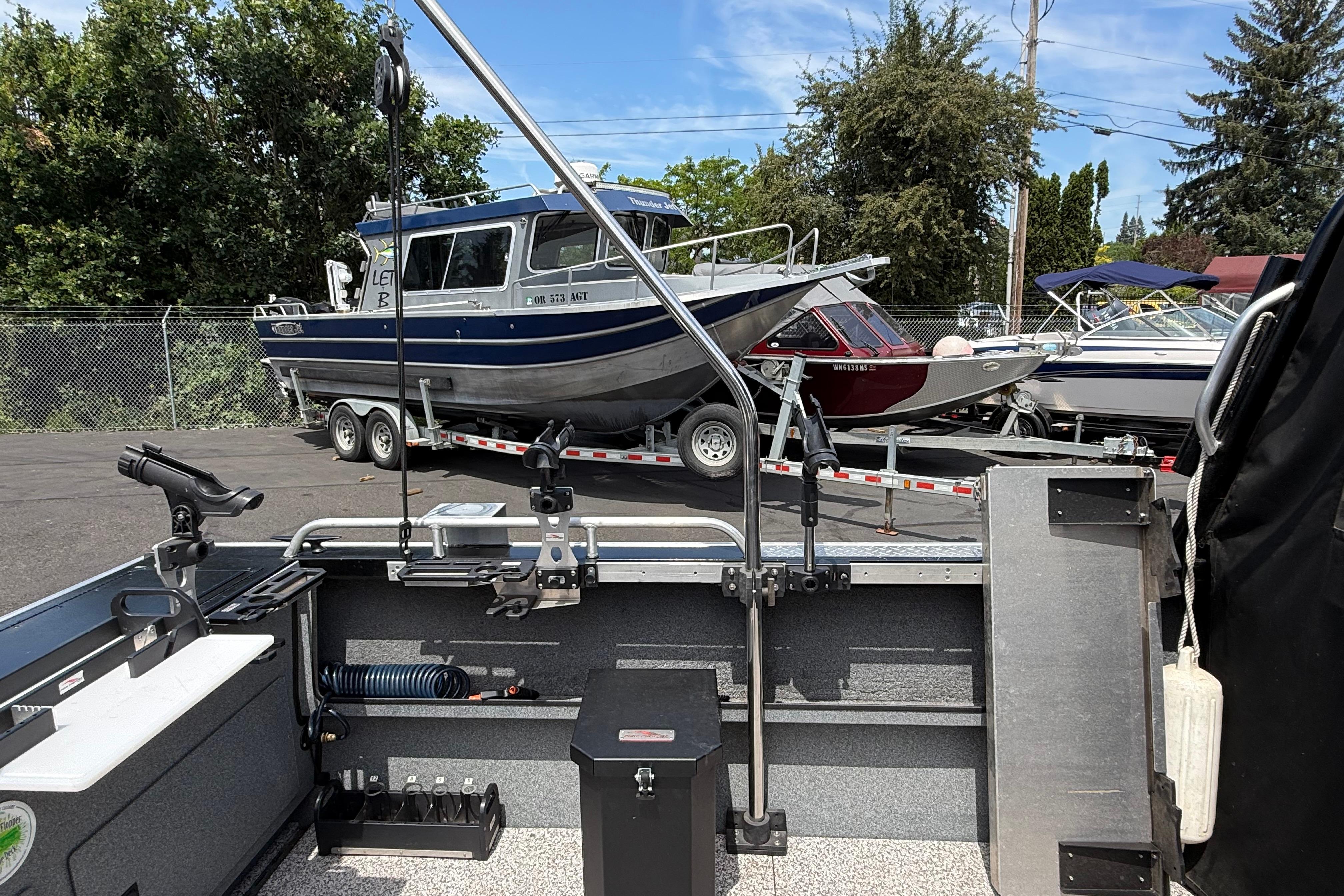 2019 Alumaweld Intruder Hard Top 22' boat on trailer, parked outdoors.