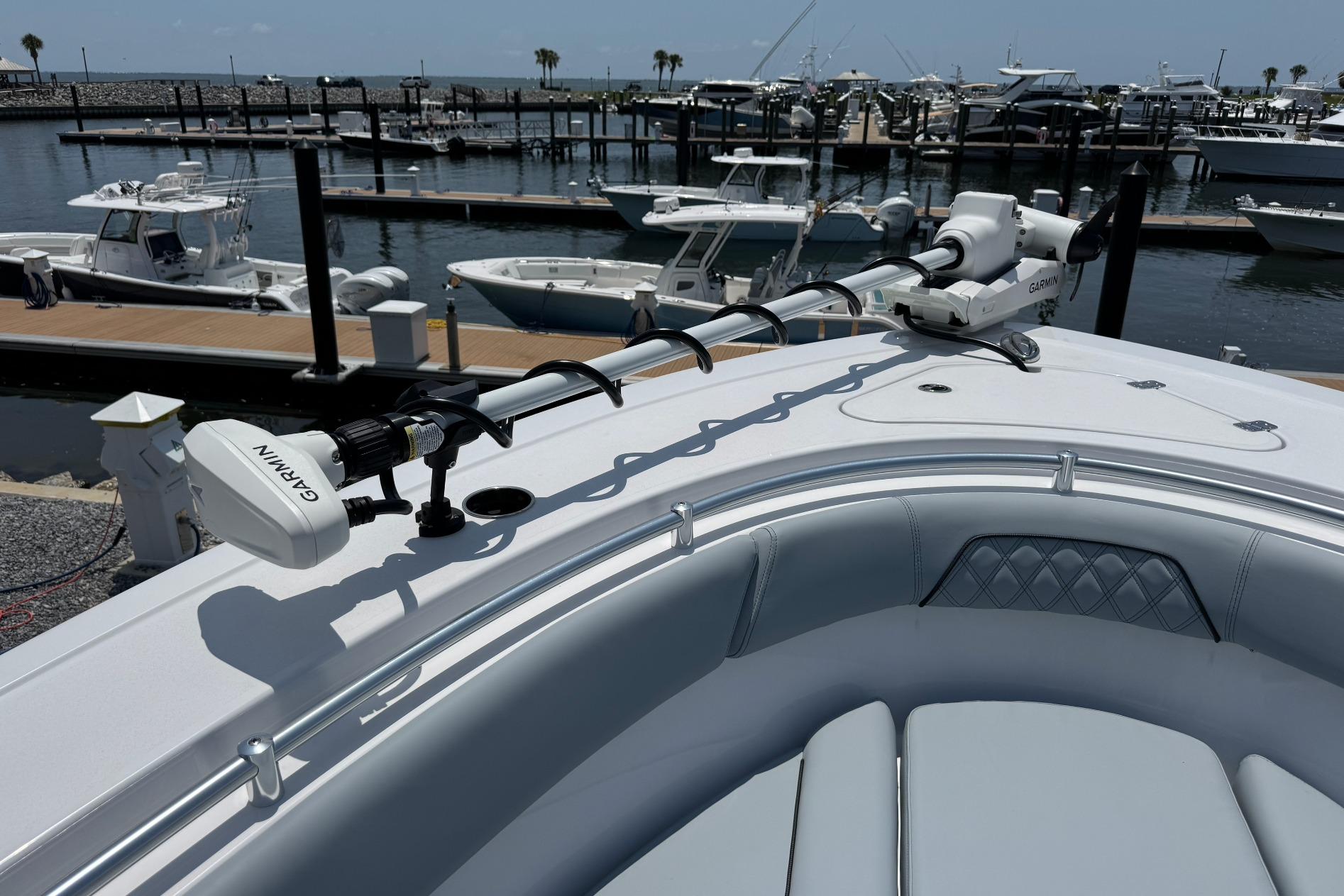 2026 Sportsman Open 262 Center Console boat docked with Garmin equipment.