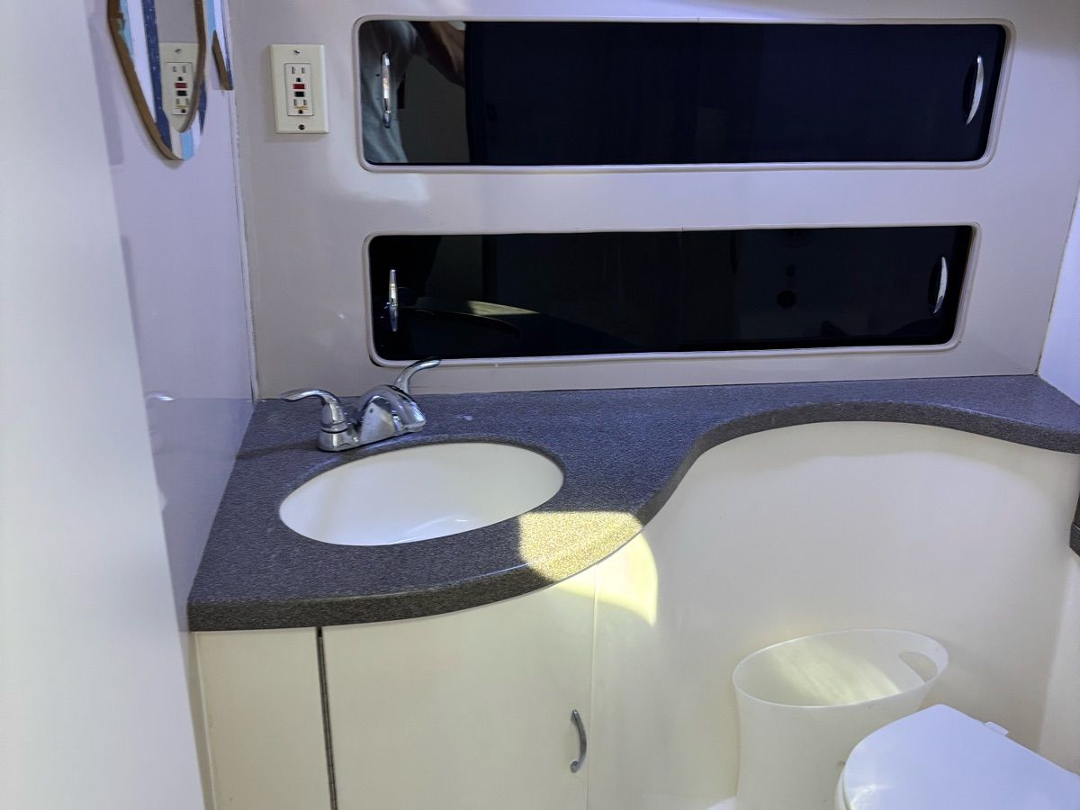 Bathroom in 1994 Luhrs Convertible boat.
