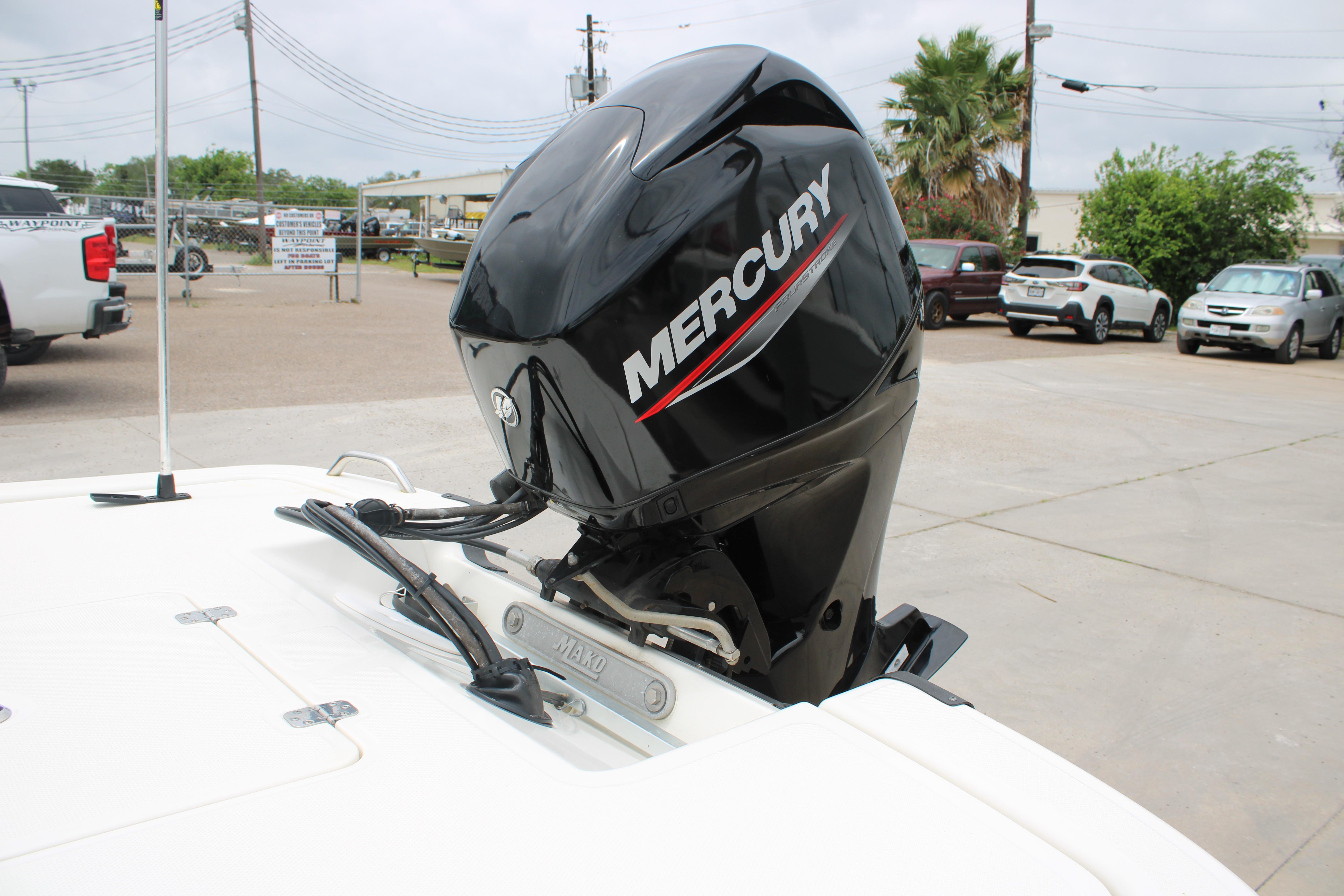 2021 Mako Pro Skiff 17 CC with Mercury outboard motor in a parking lot.