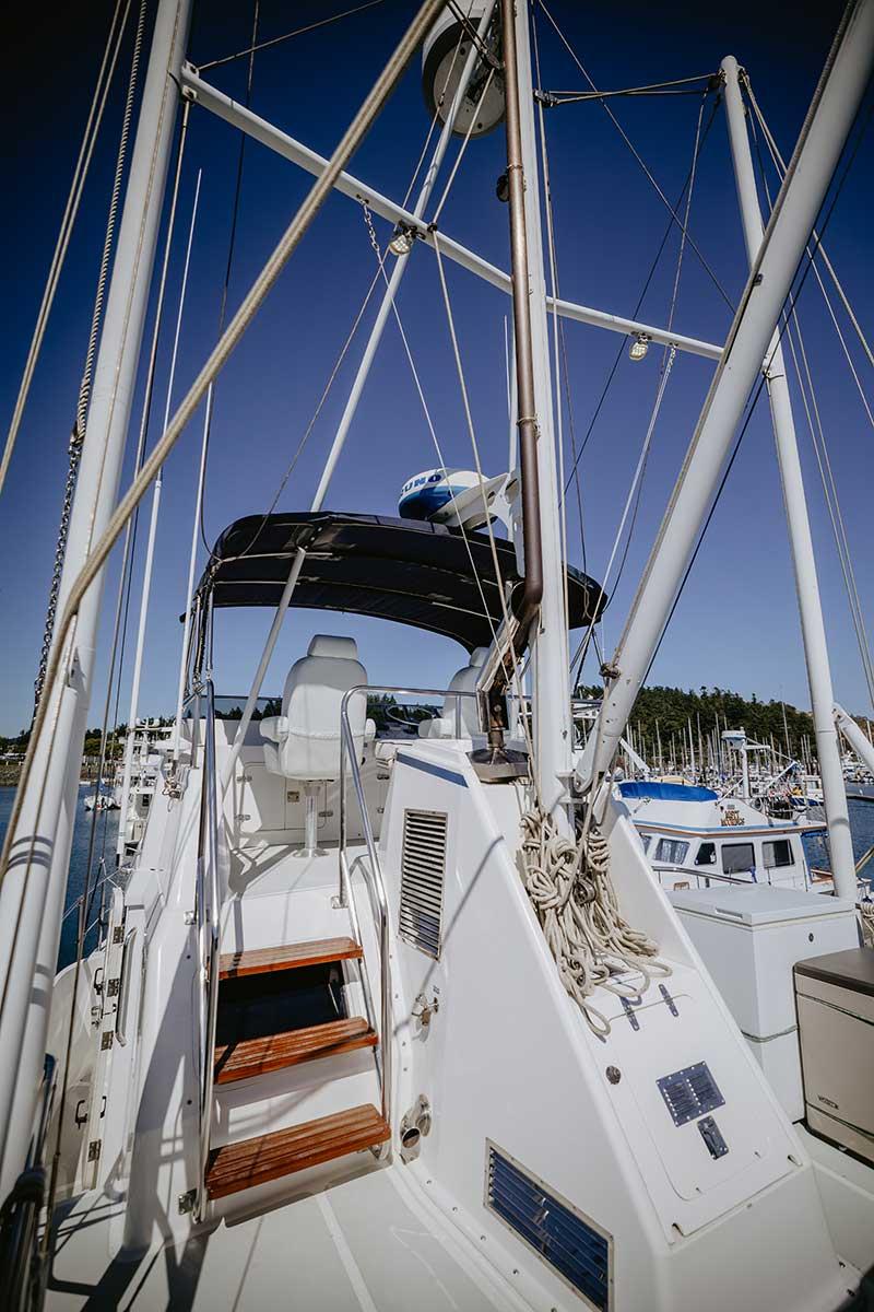 2004 Nordhavn 43 yacht deck with stairs and rigging, docked at marina.
