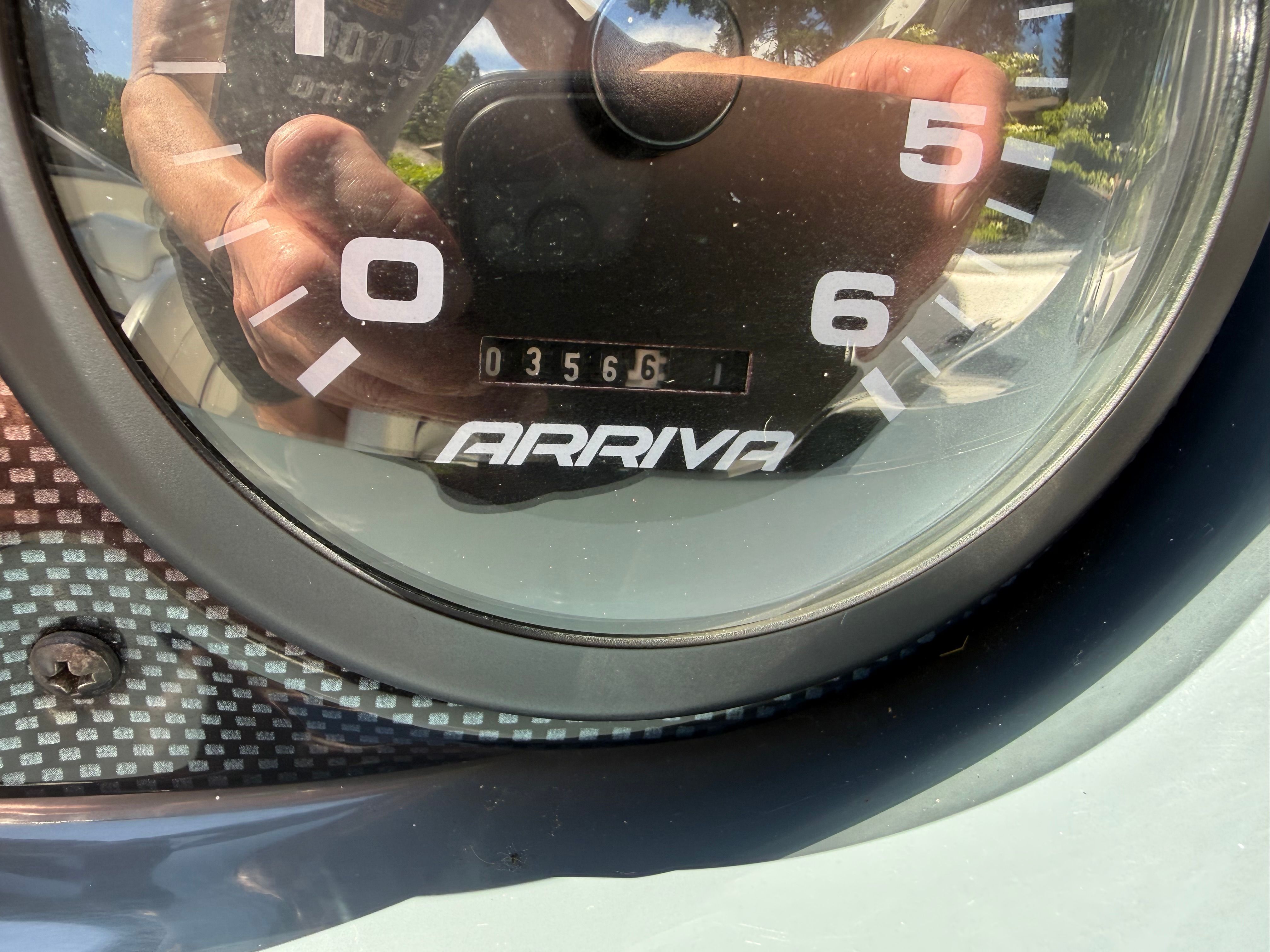 Close-up of a speedometer with Arriva logo and mileage reading 356.1.