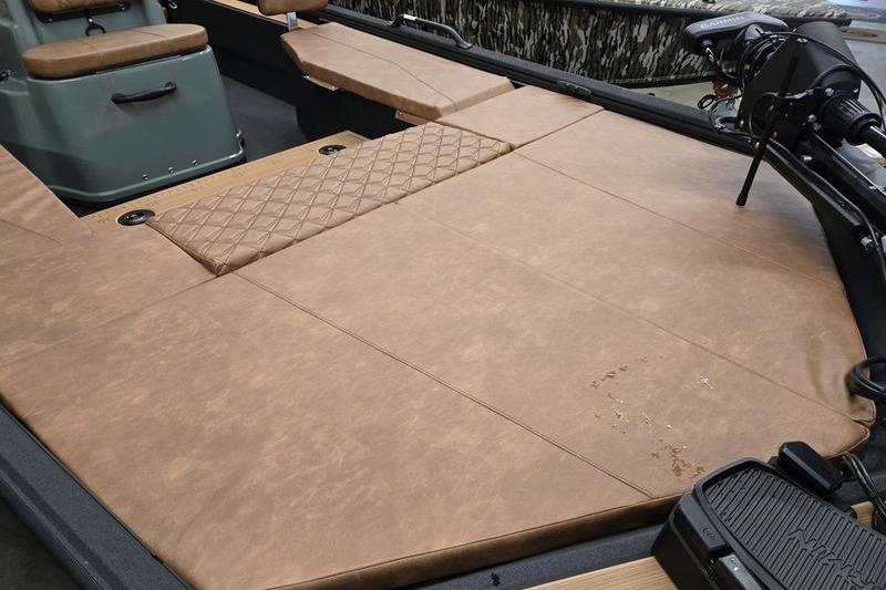 Avid 207 Recon 2026 boat interior with tan cushioned seating and modern design.