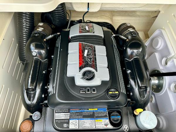 Engine of 2022 Bayliner DX 2050 boat, showcasing powerful design and components.
